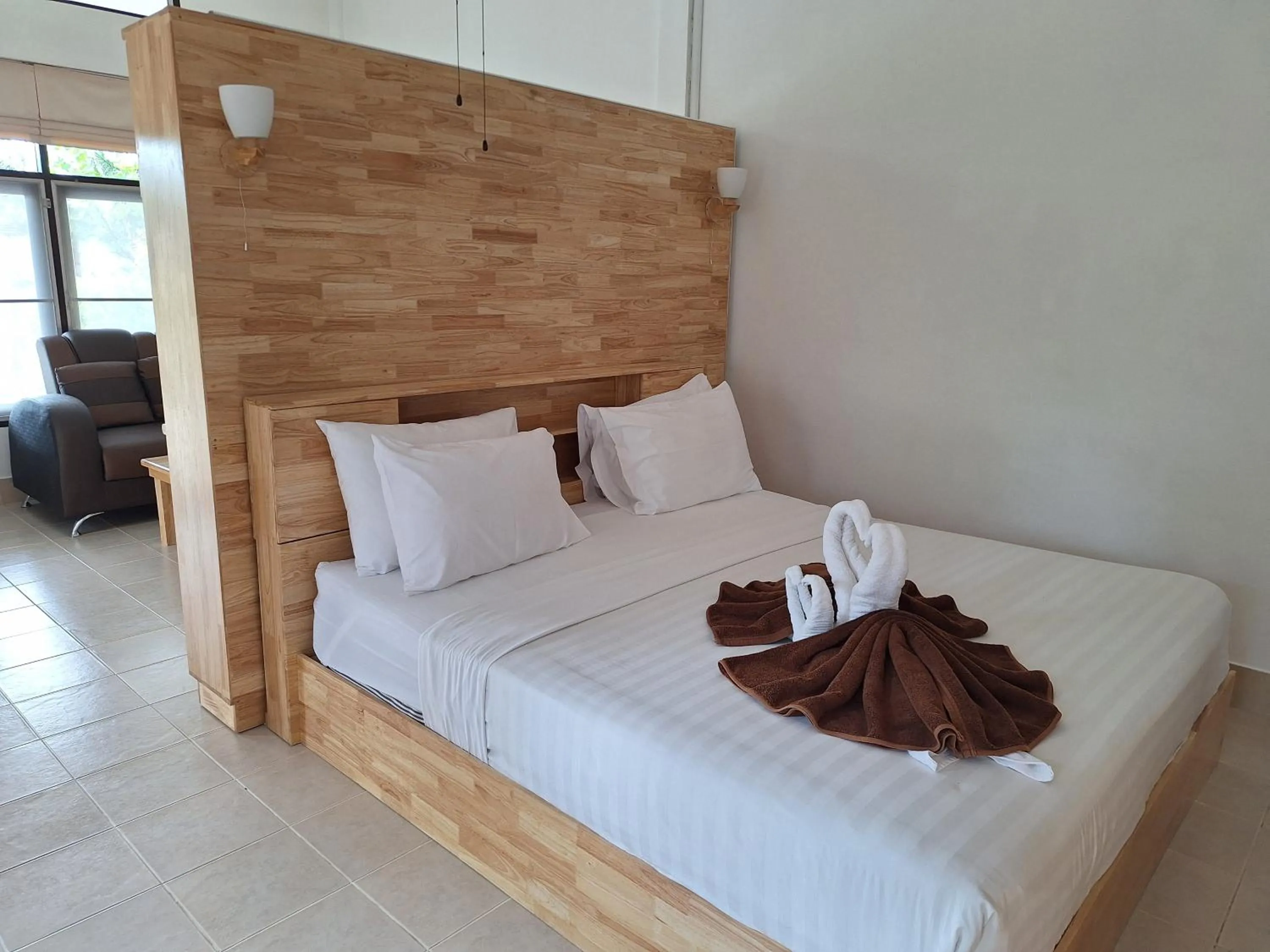 Bed in Jungle Village Bungalow