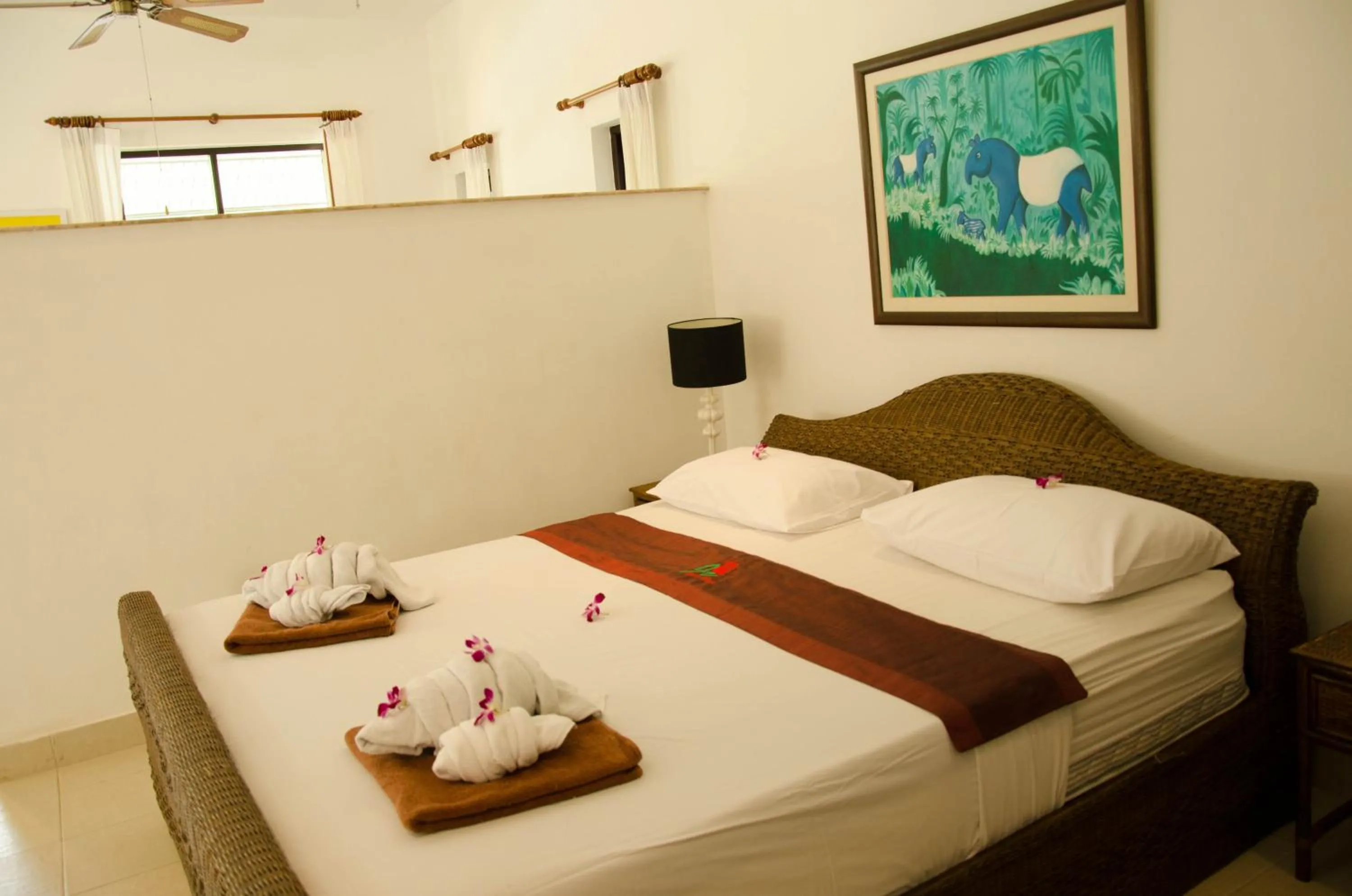 Bed in Jungle Village Bungalow