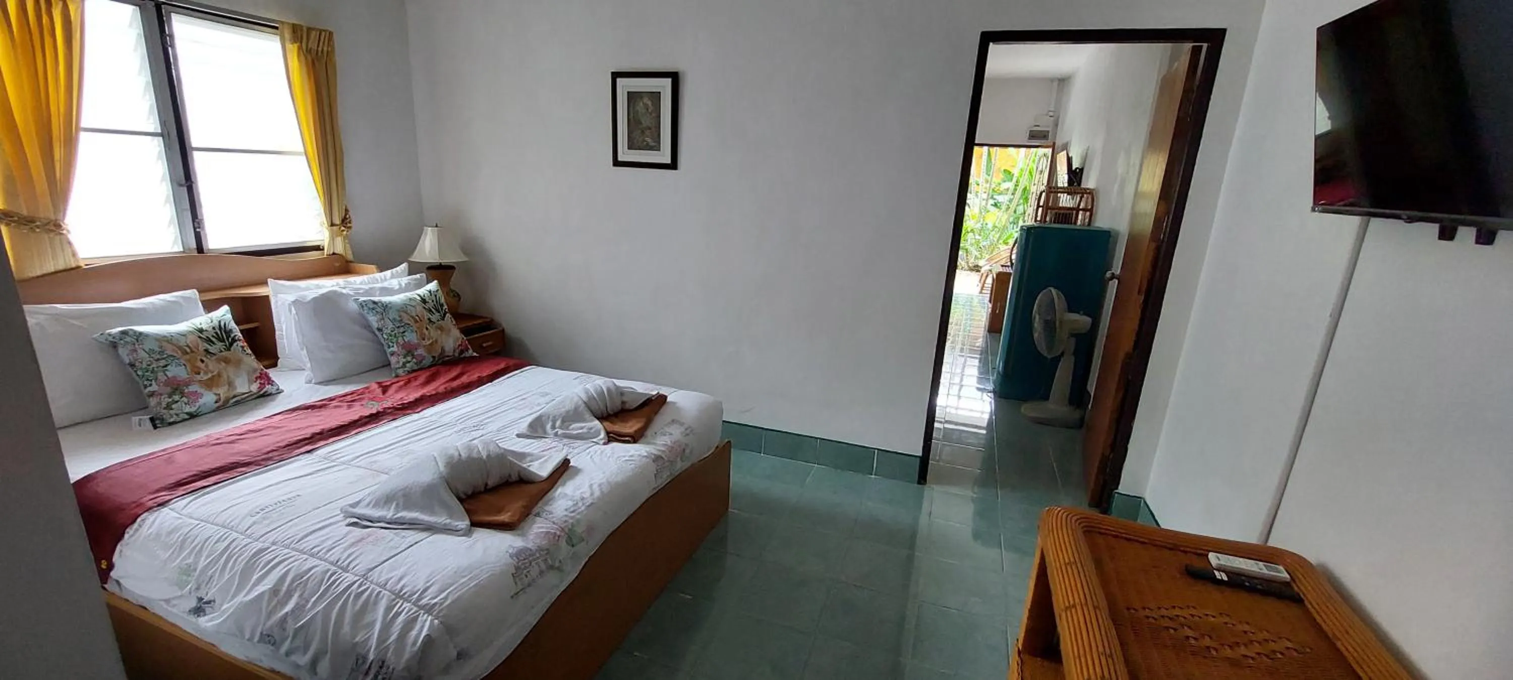 Bed in Jungle Village Bungalow