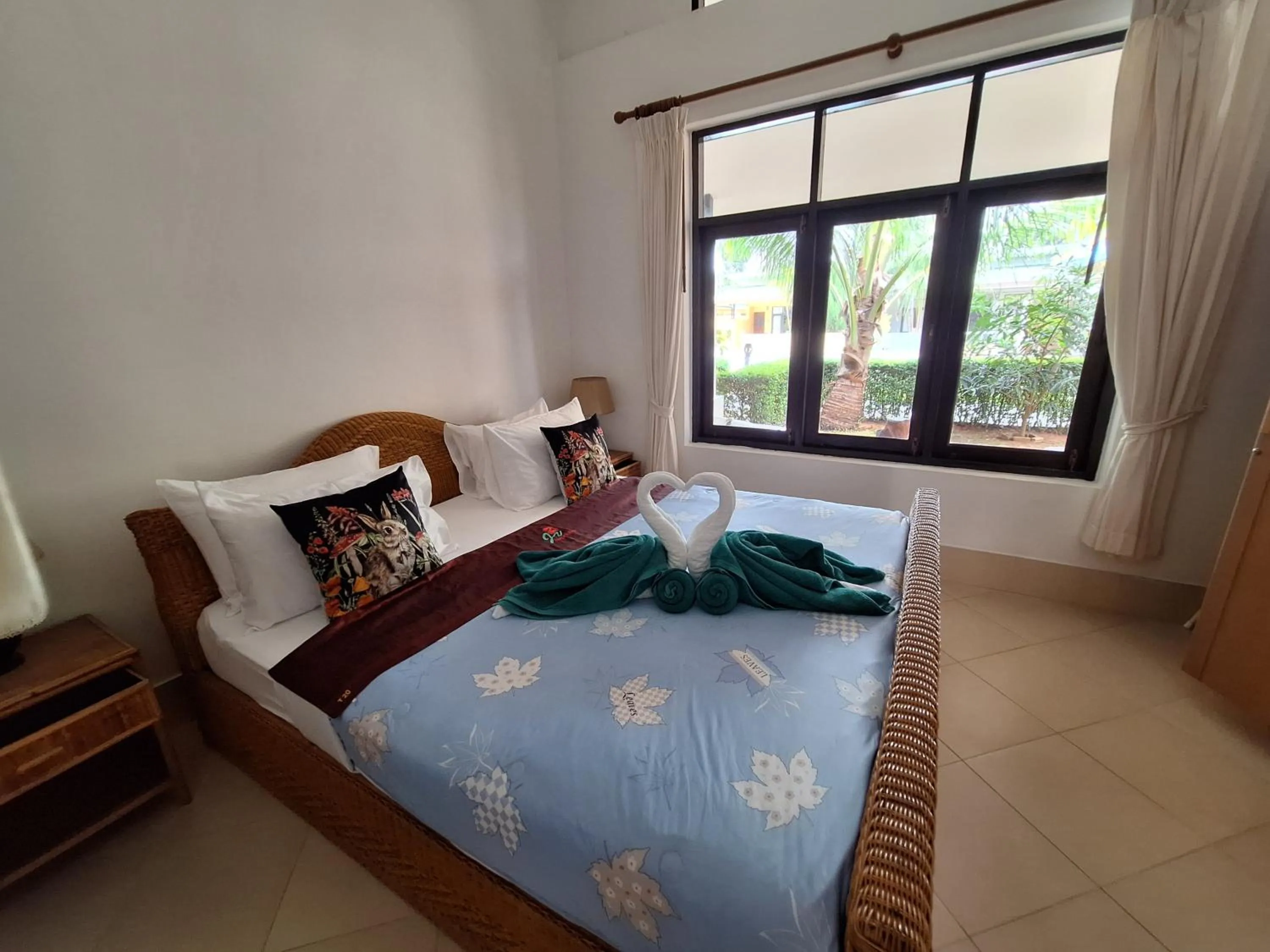 Bed in Jungle Village Bungalow