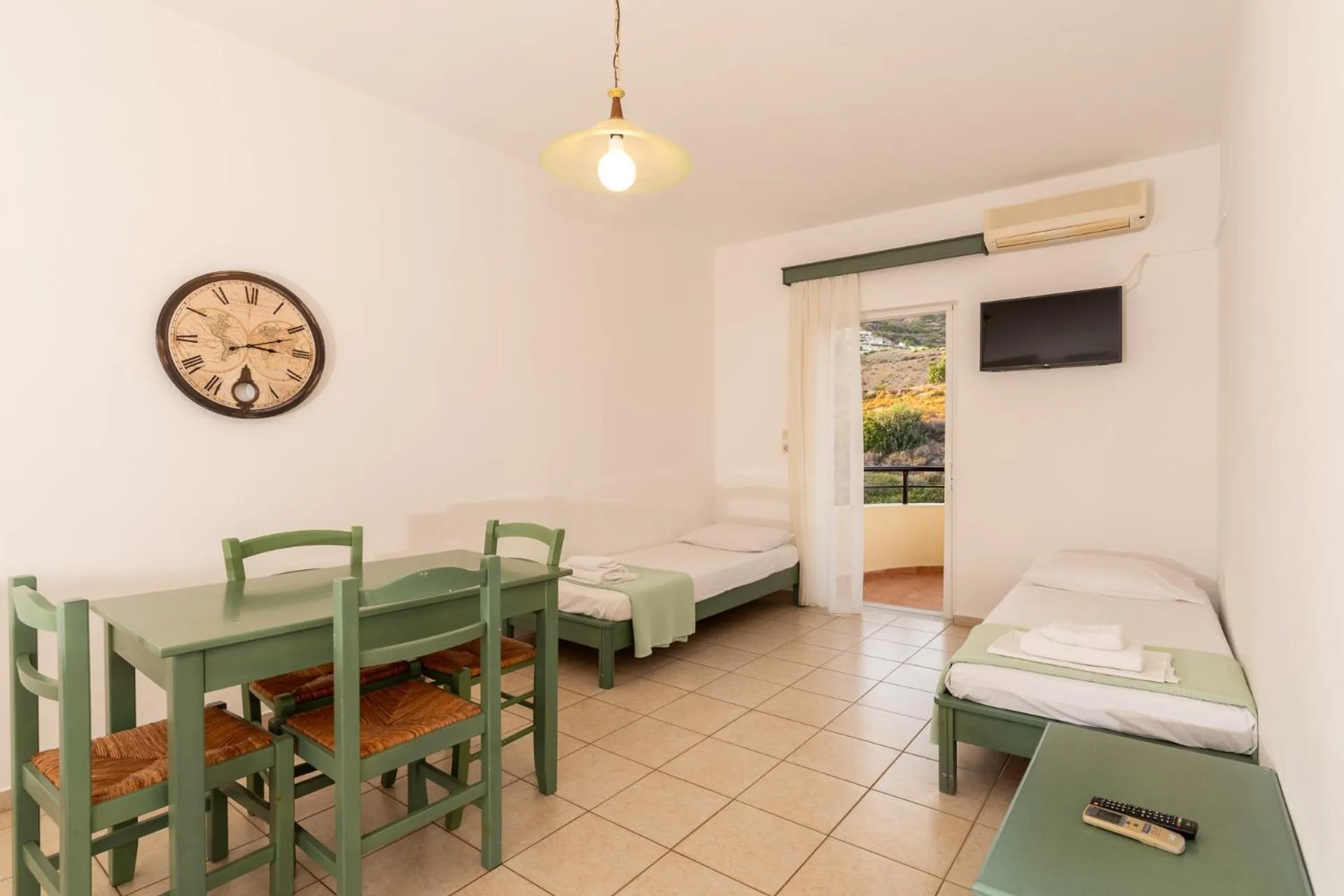 Bed in Elpis Studio Apartments