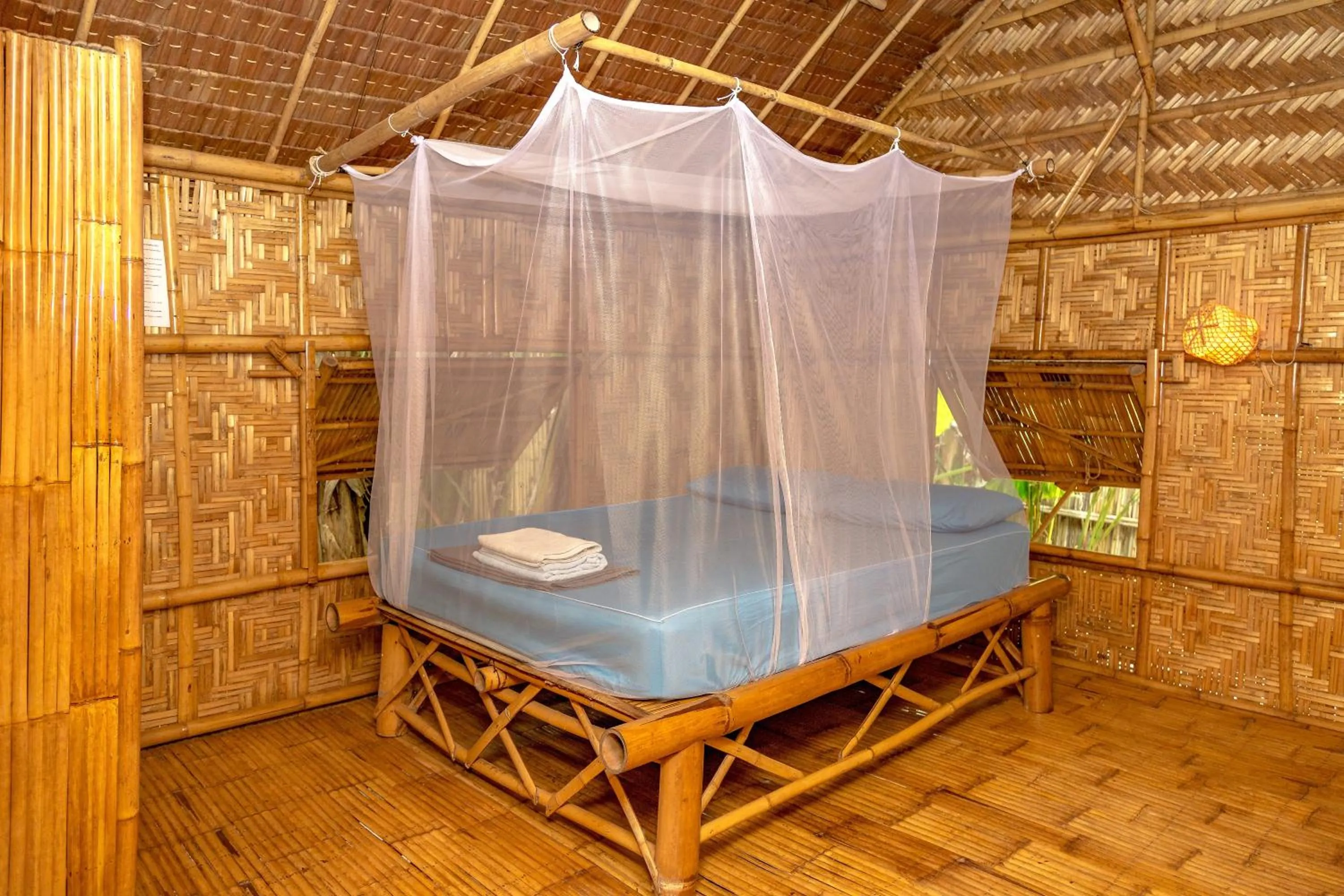 Bed in Forra Dive Resort Sunrise