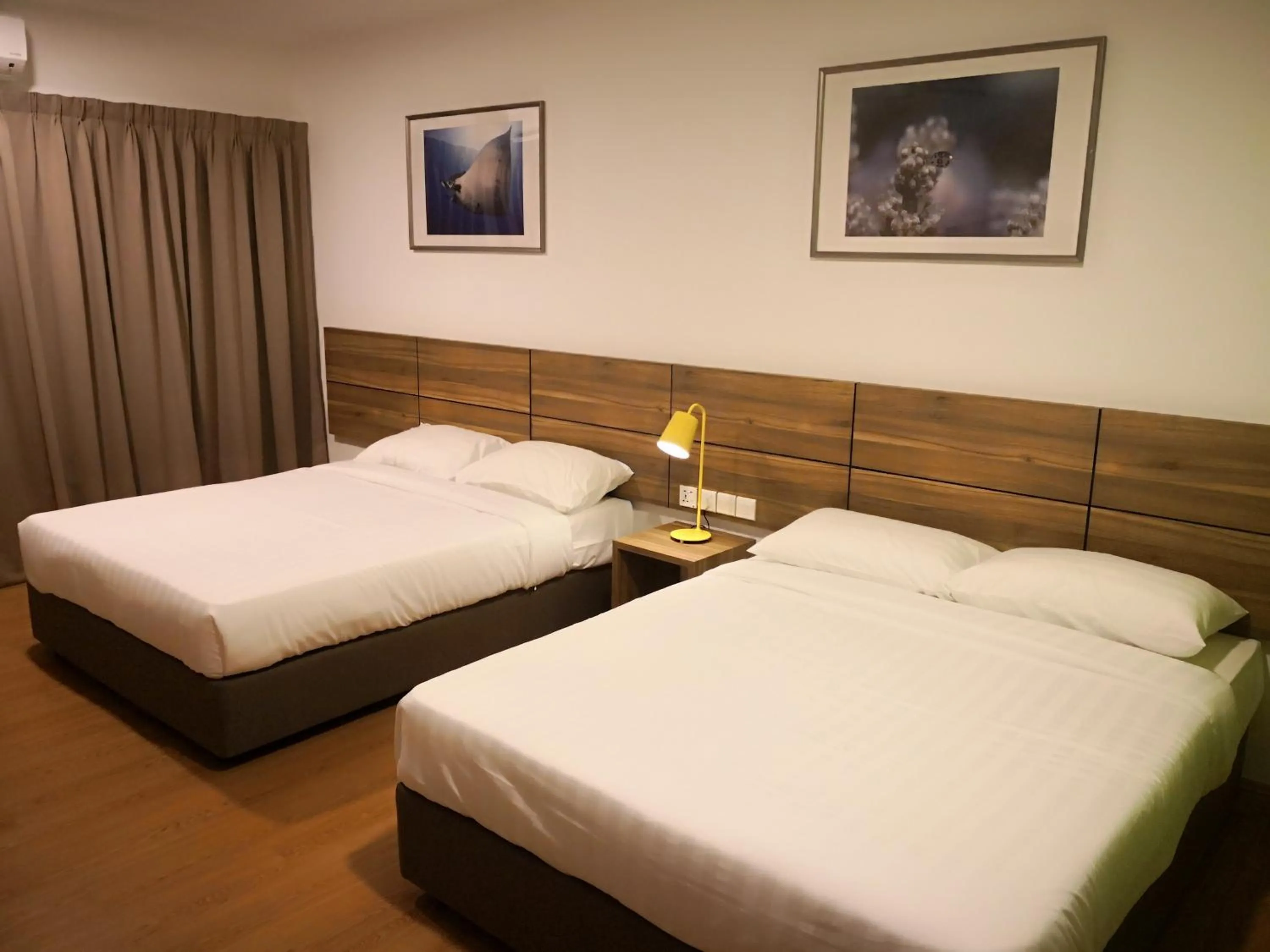 Bed in Aman Tioman Beach Resort