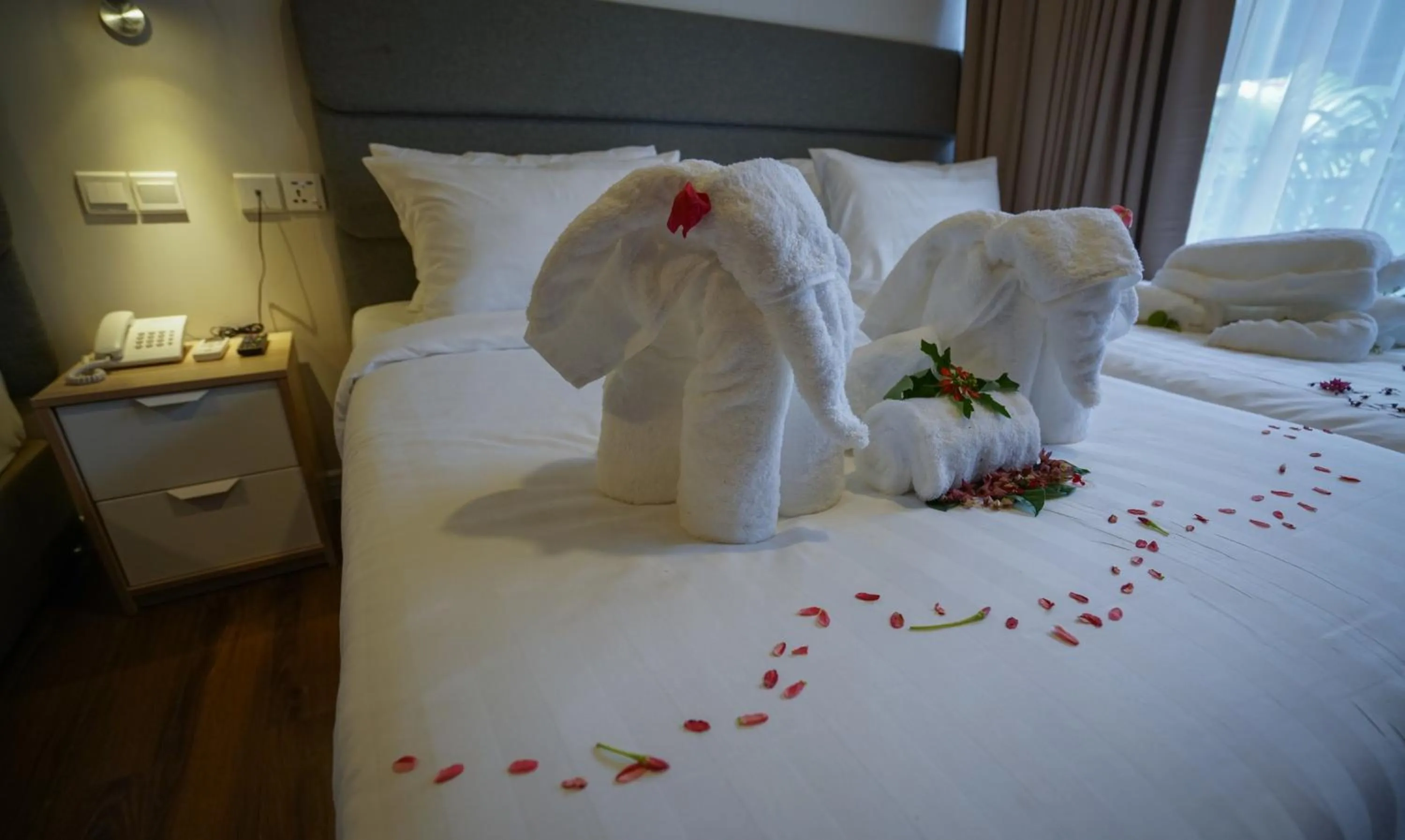 Bed in Aman Tioman Beach Resort