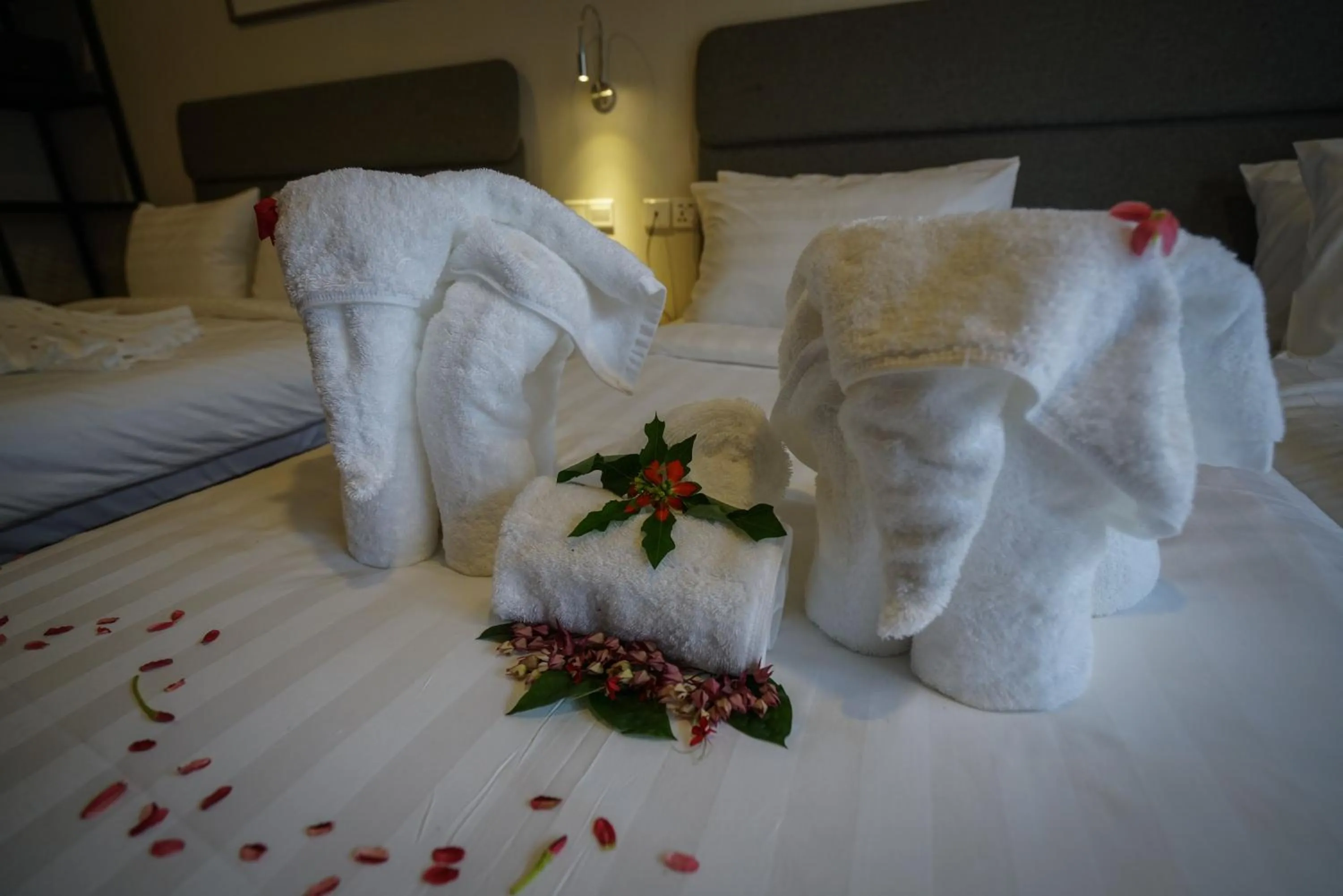 Bed in Aman Tioman Beach Resort