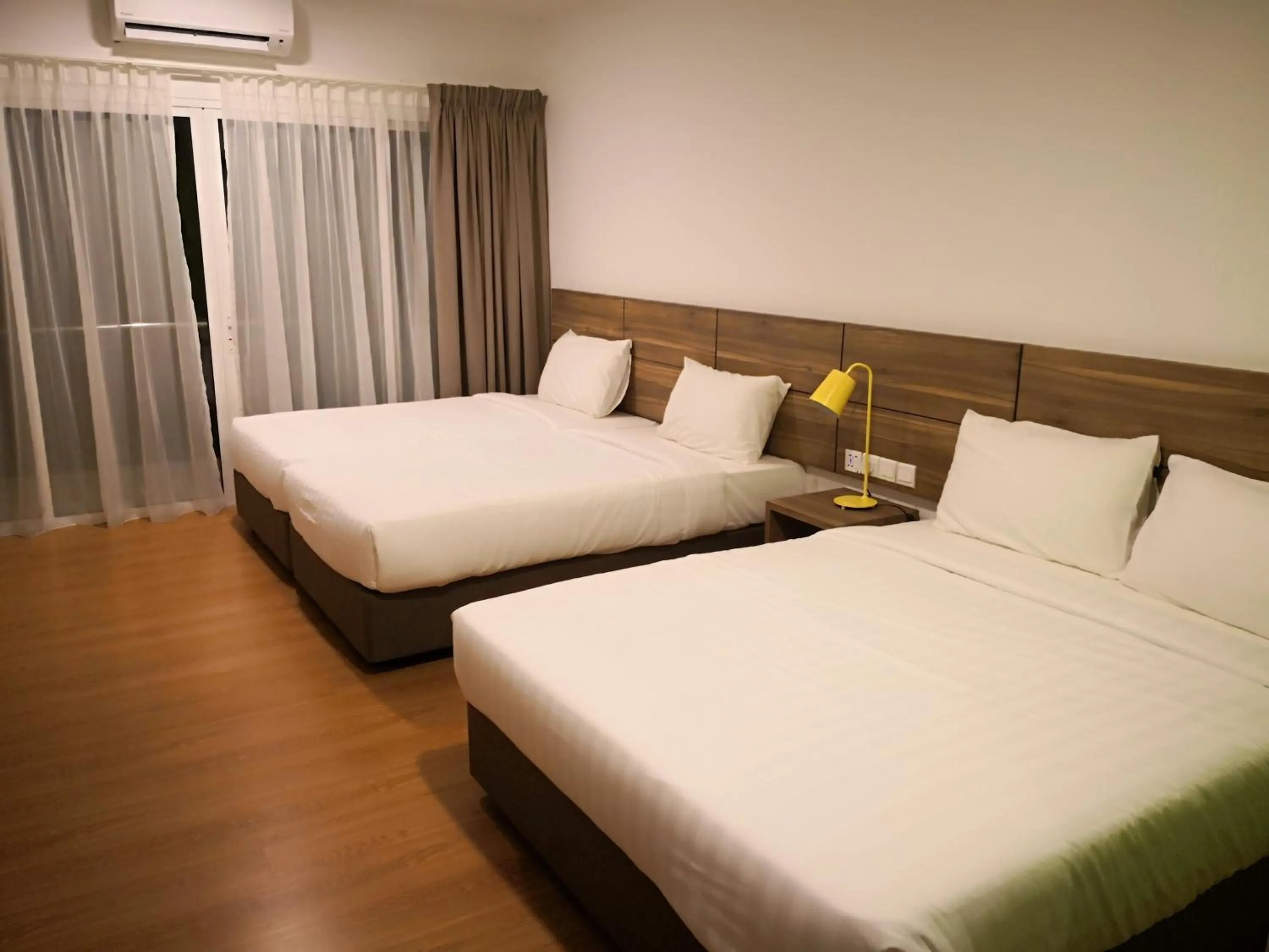 Bed in Aman Tioman Beach Resort