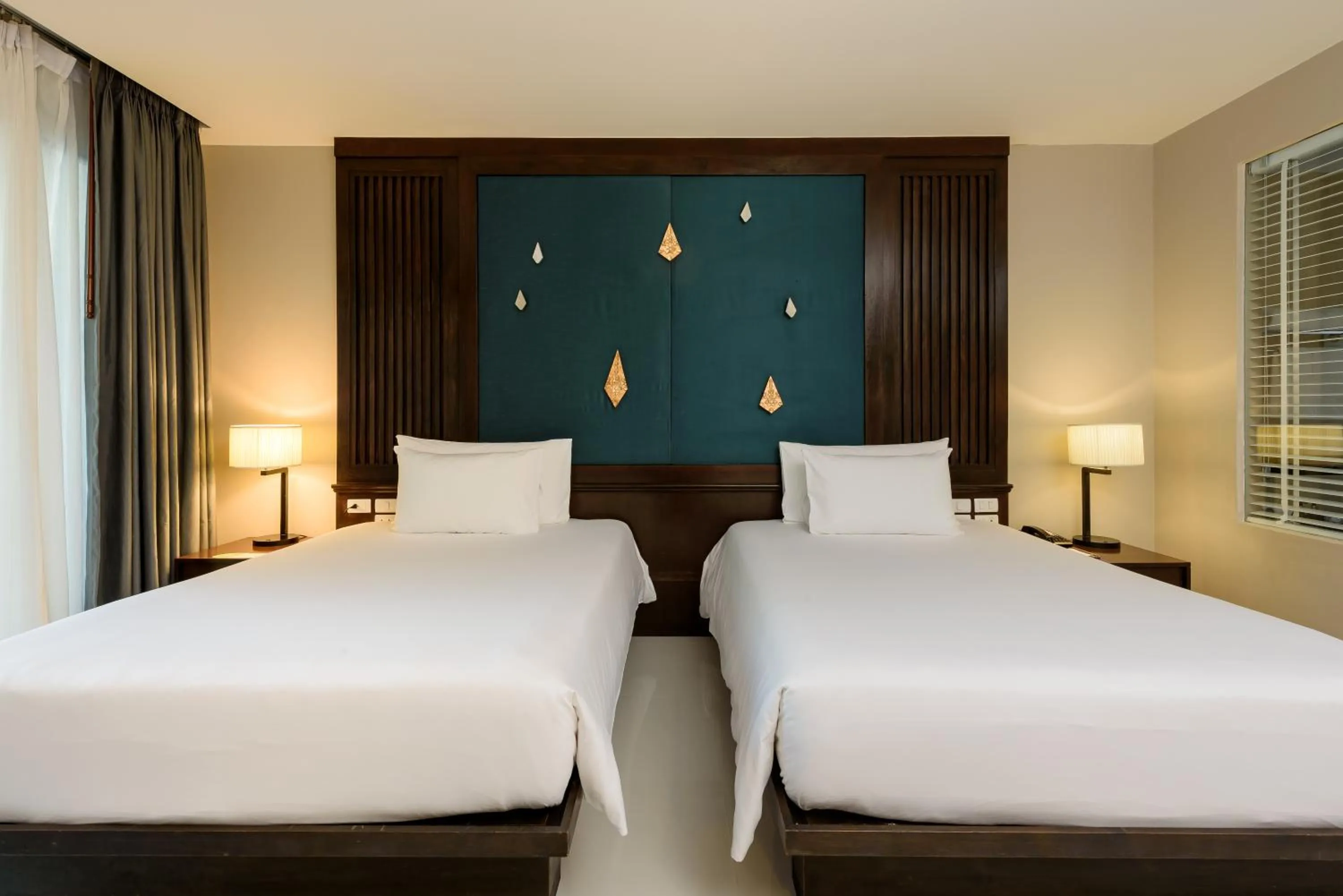 Bed in Centara Anda Dhevi Resort & Spa Krabi