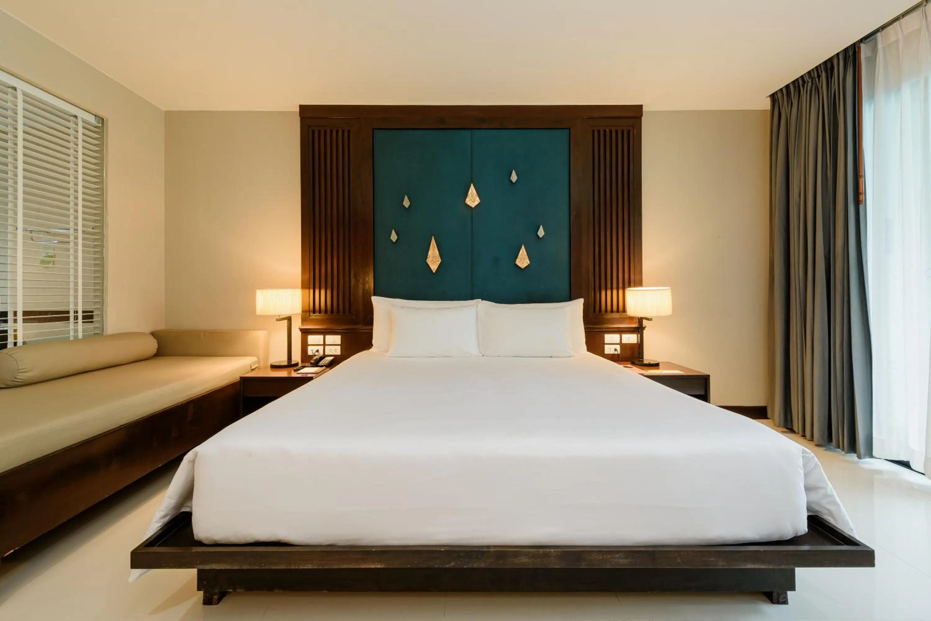 Bed in Centara Anda Dhevi Resort & Spa Krabi