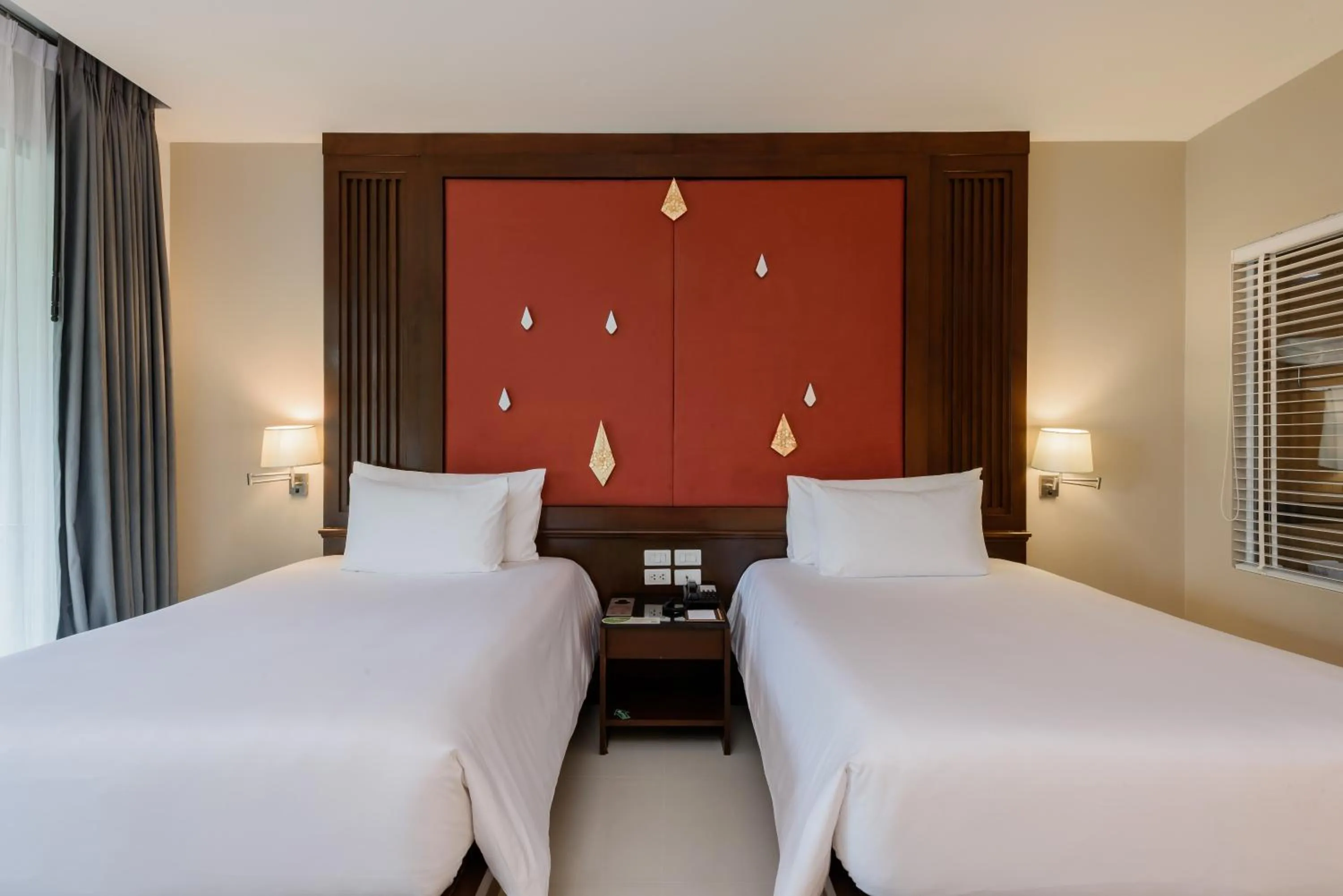 Bed in Centara Anda Dhevi Resort & Spa Krabi