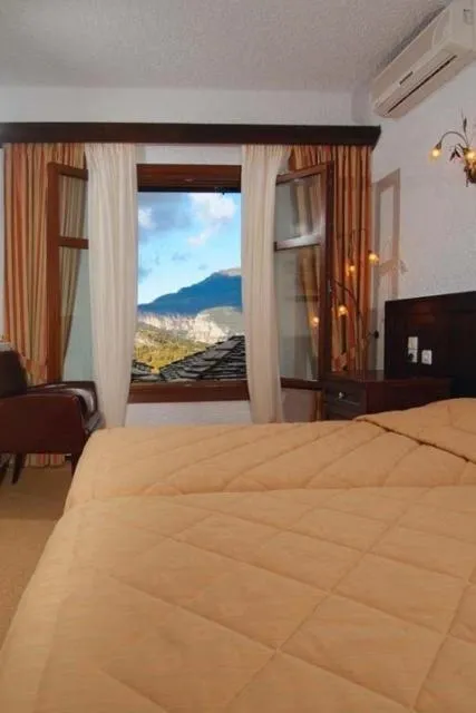 Bed in Hotel Taxiarches