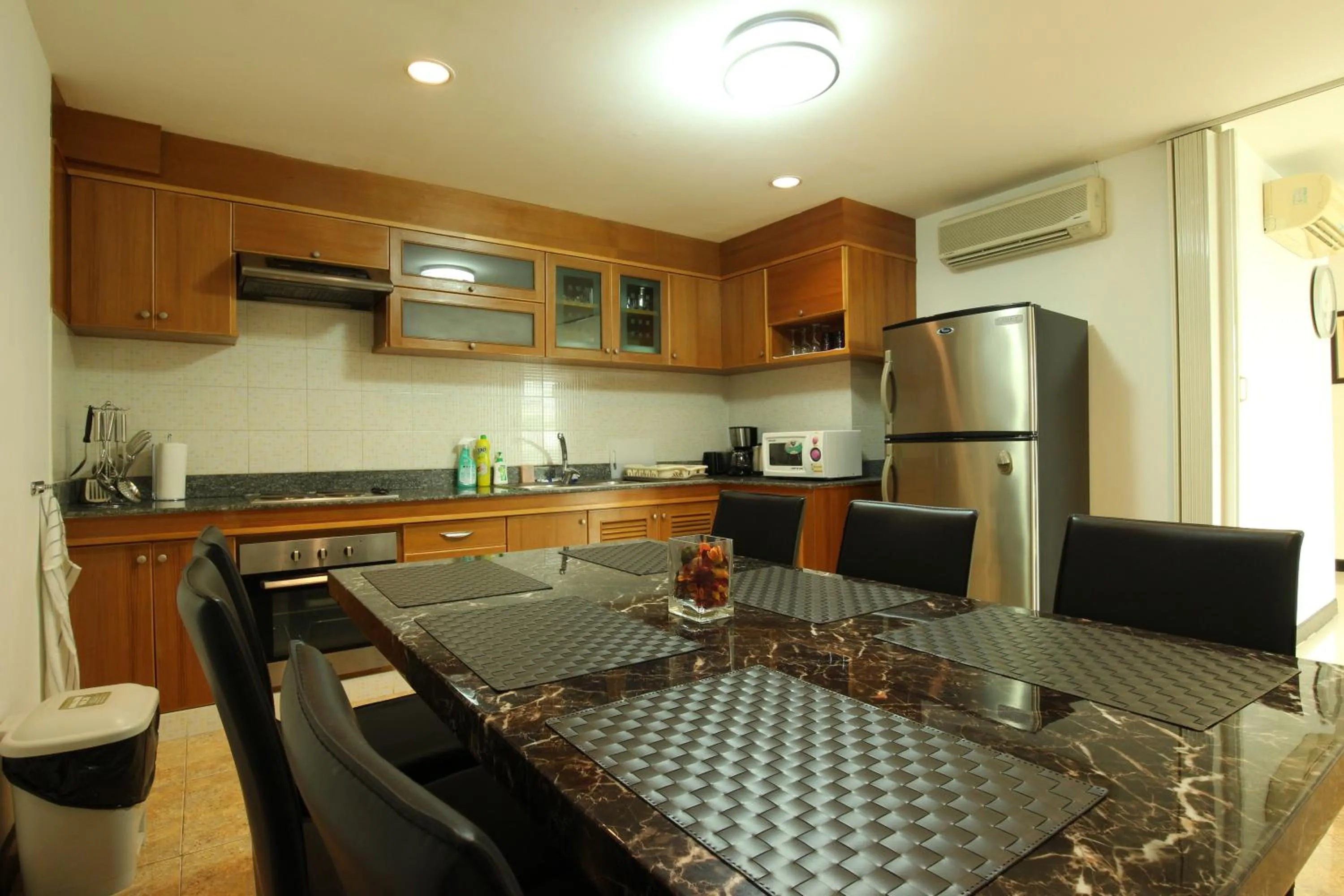 Kitchen or kitchenette in Serena Sathorn Suites