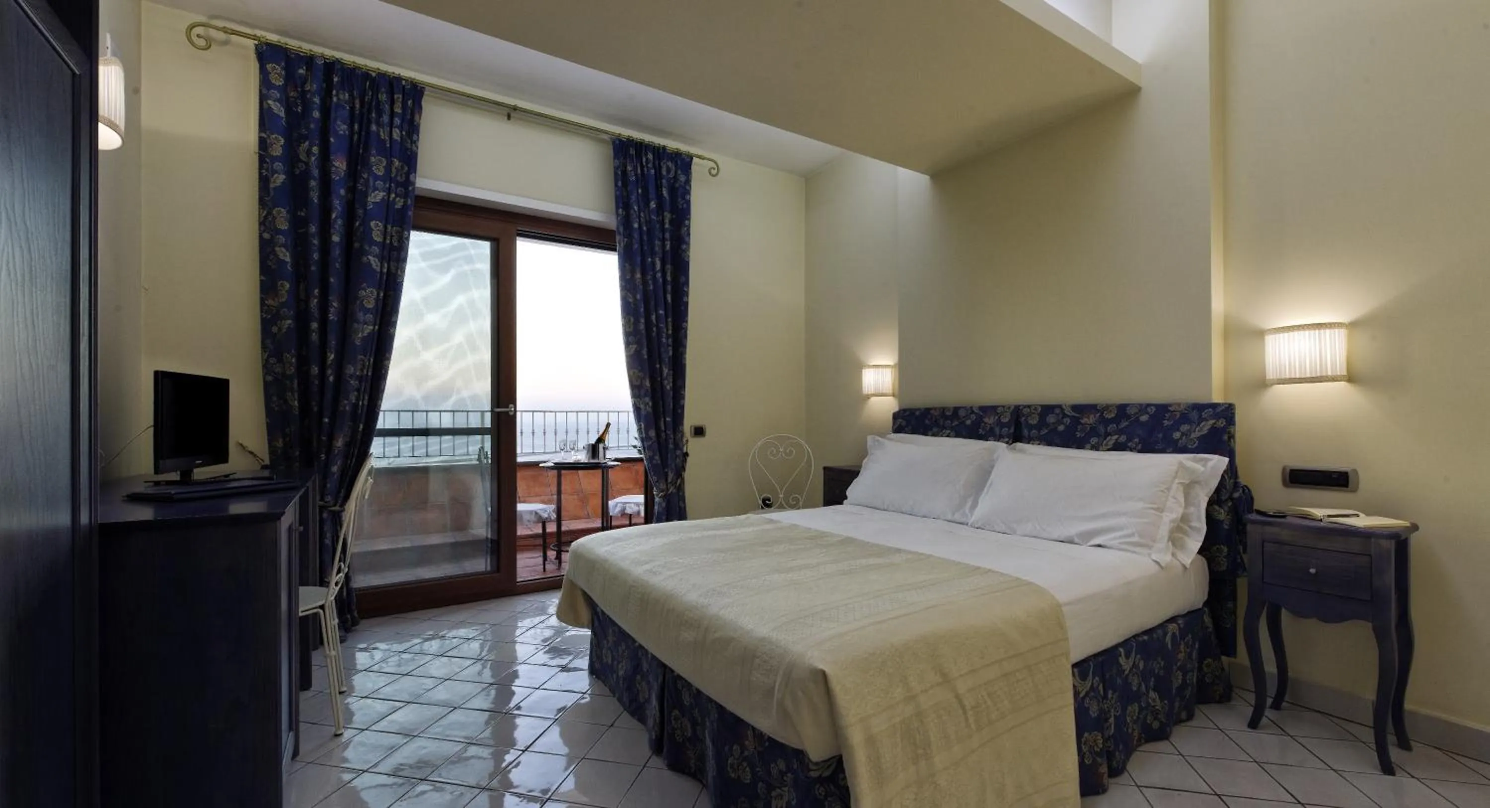 Bed in Villa Poseidon -Boutique Hotel-