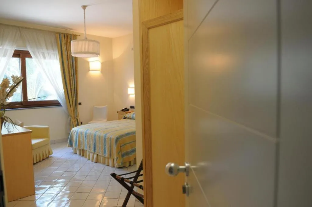 Bed in Villa Poseidon -Boutique Hotel-