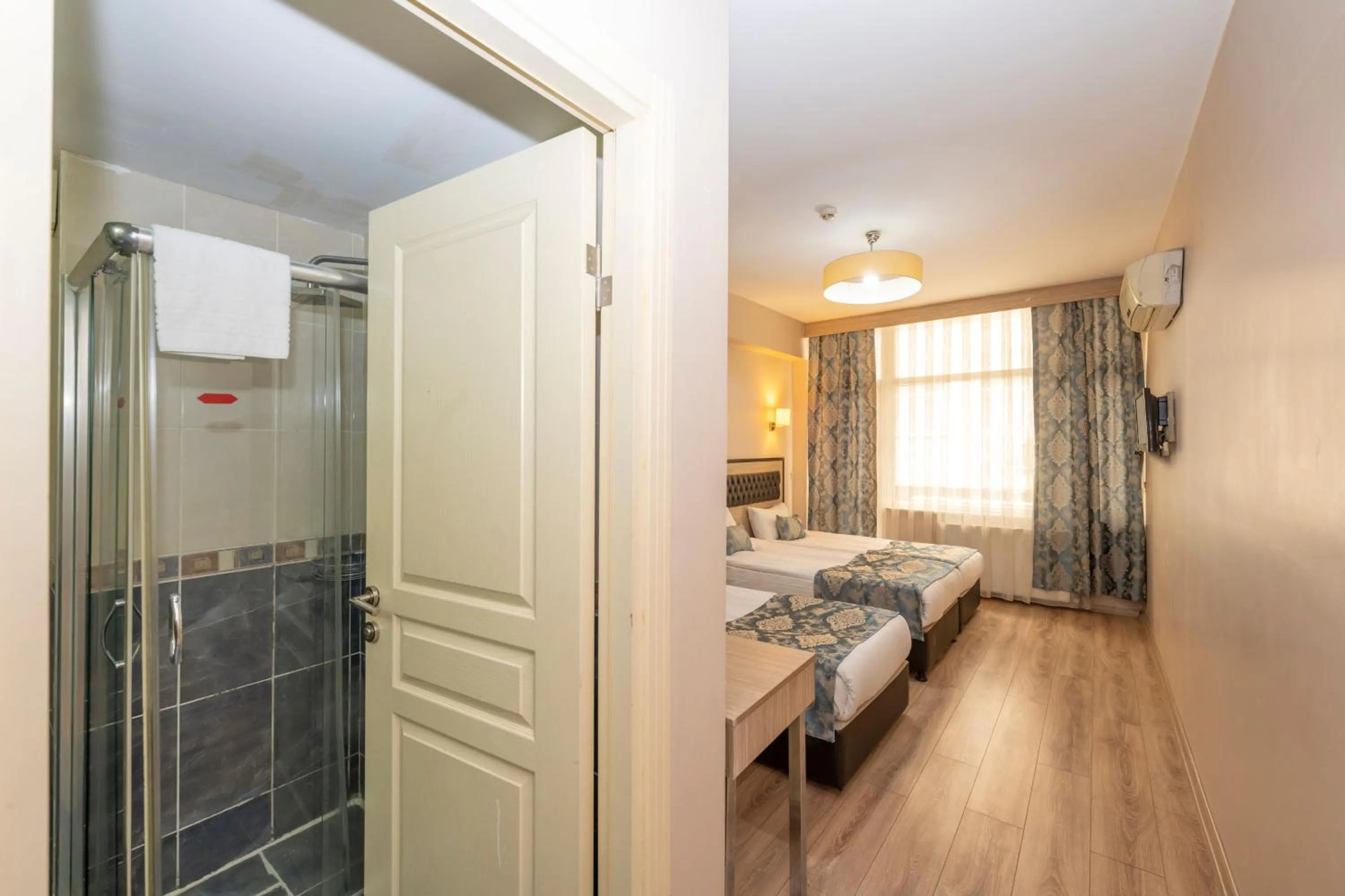 Bathroom, Bed in Tugra Hotel