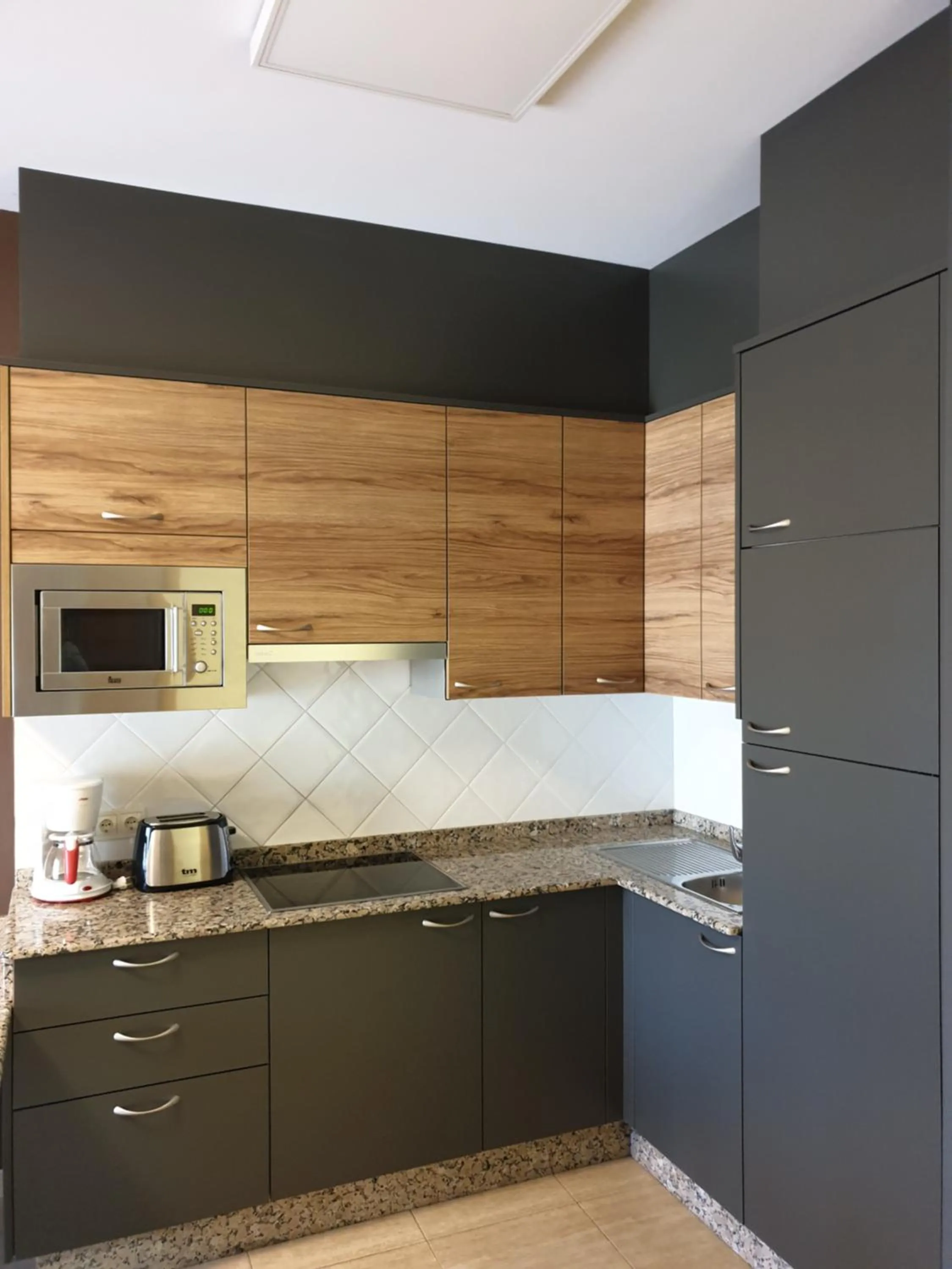 Kitchen or kitchenette in Apartamentos Atlántico Resort