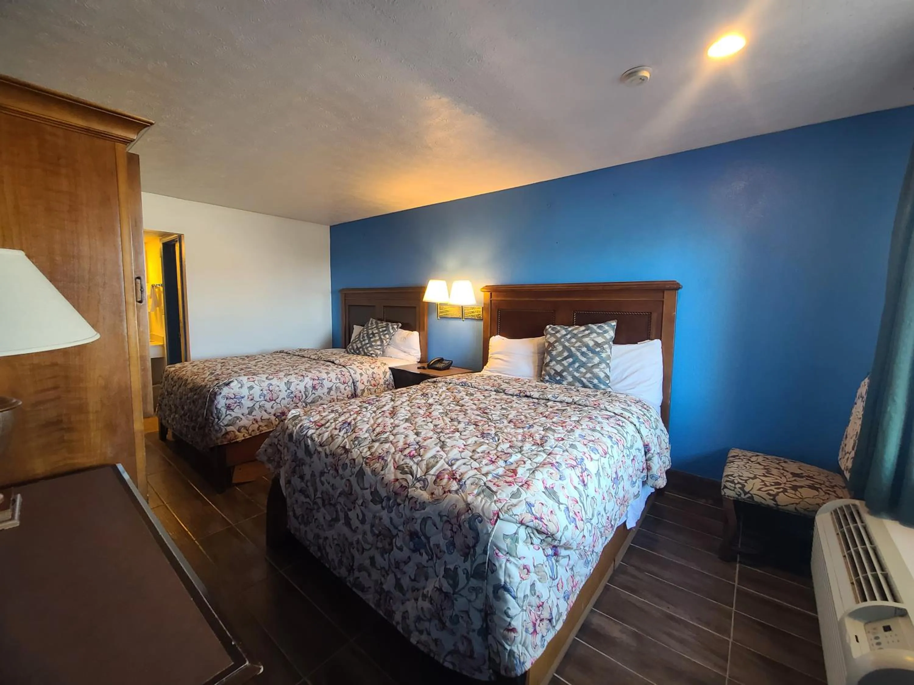 Bed in Garden Inn and Extended Stay