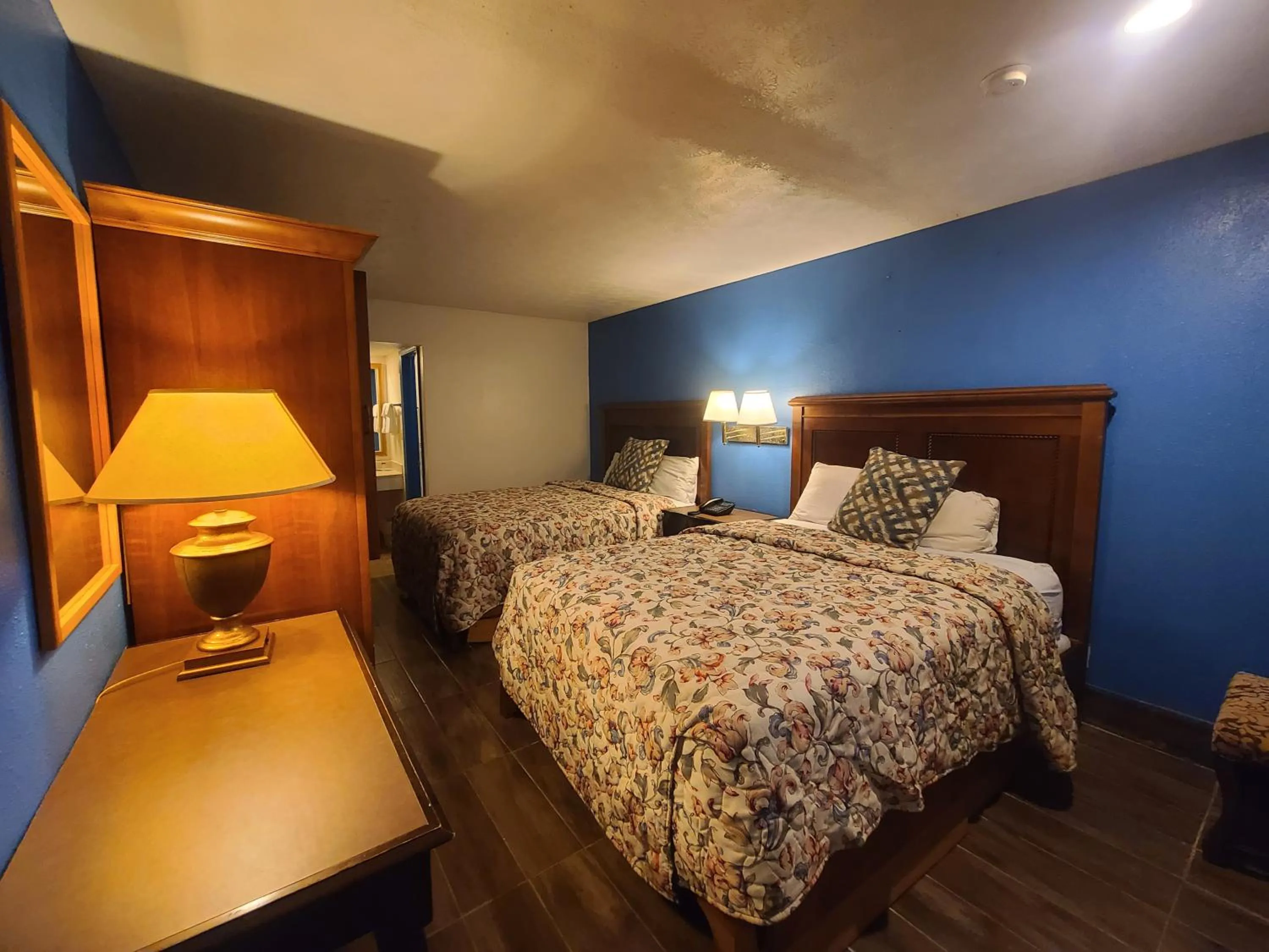 Bed in Garden Inn and Extended Stay