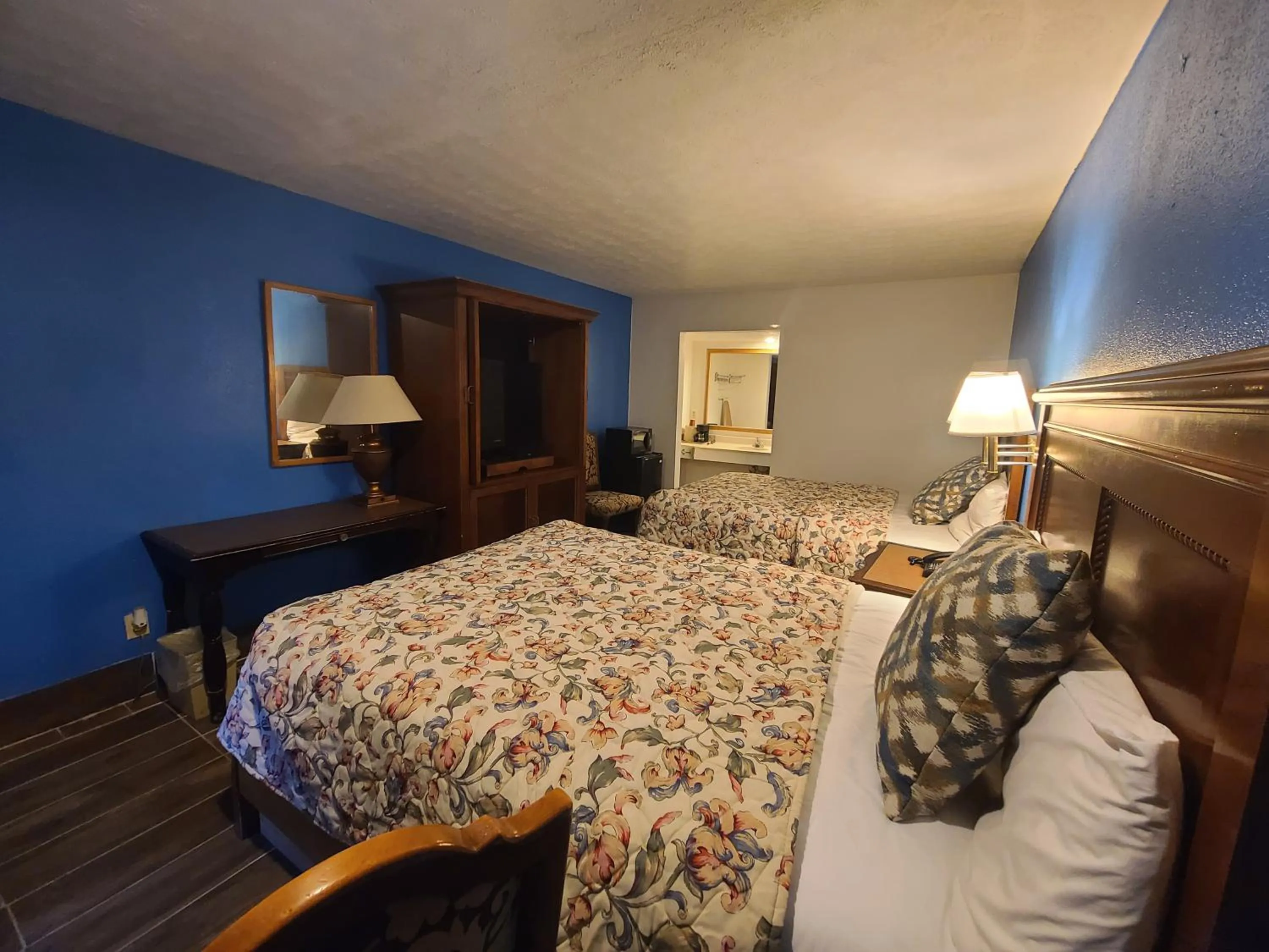 Bed in Garden Inn and Extended Stay