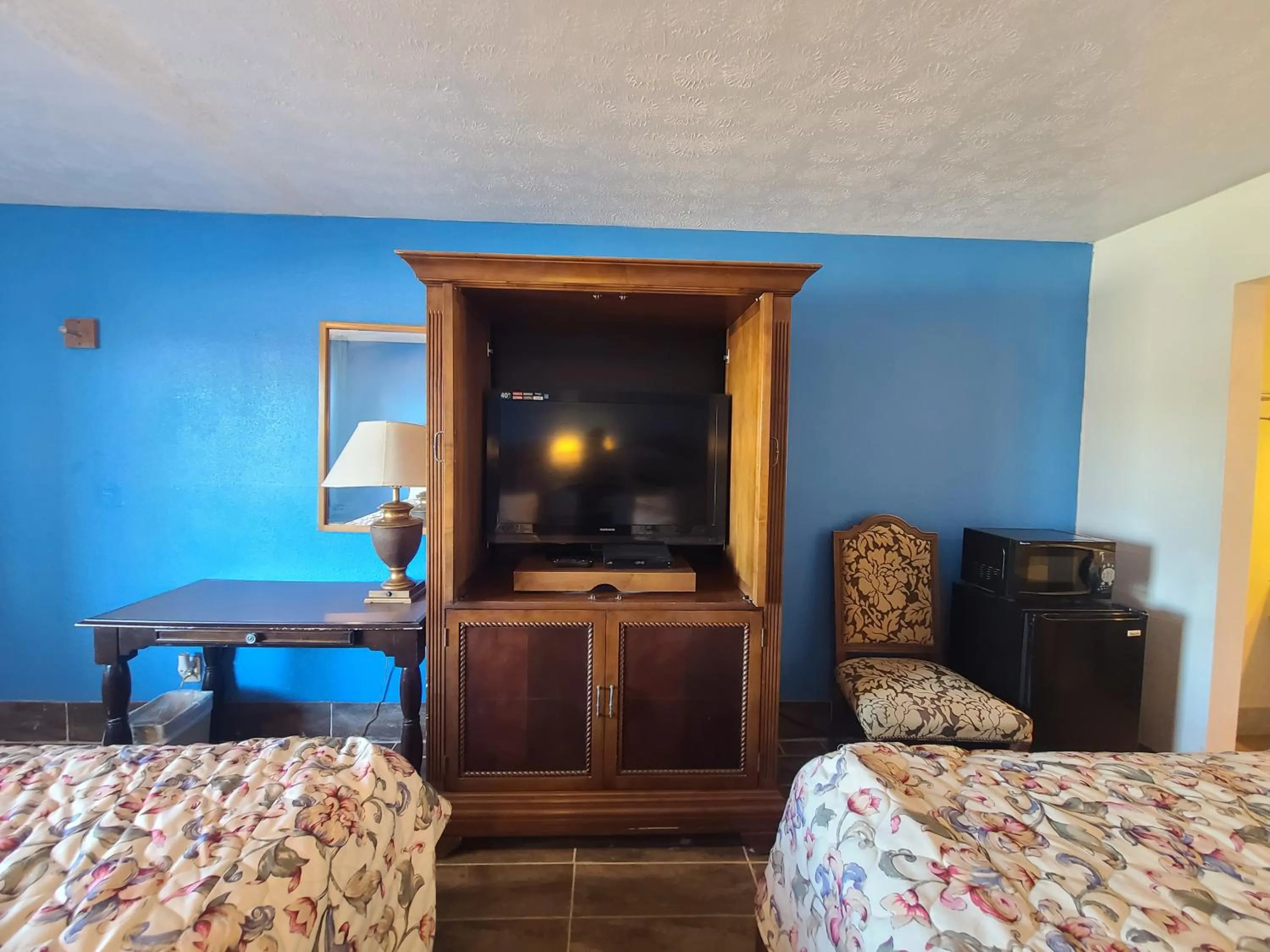 Bed in Garden Inn and Extended Stay