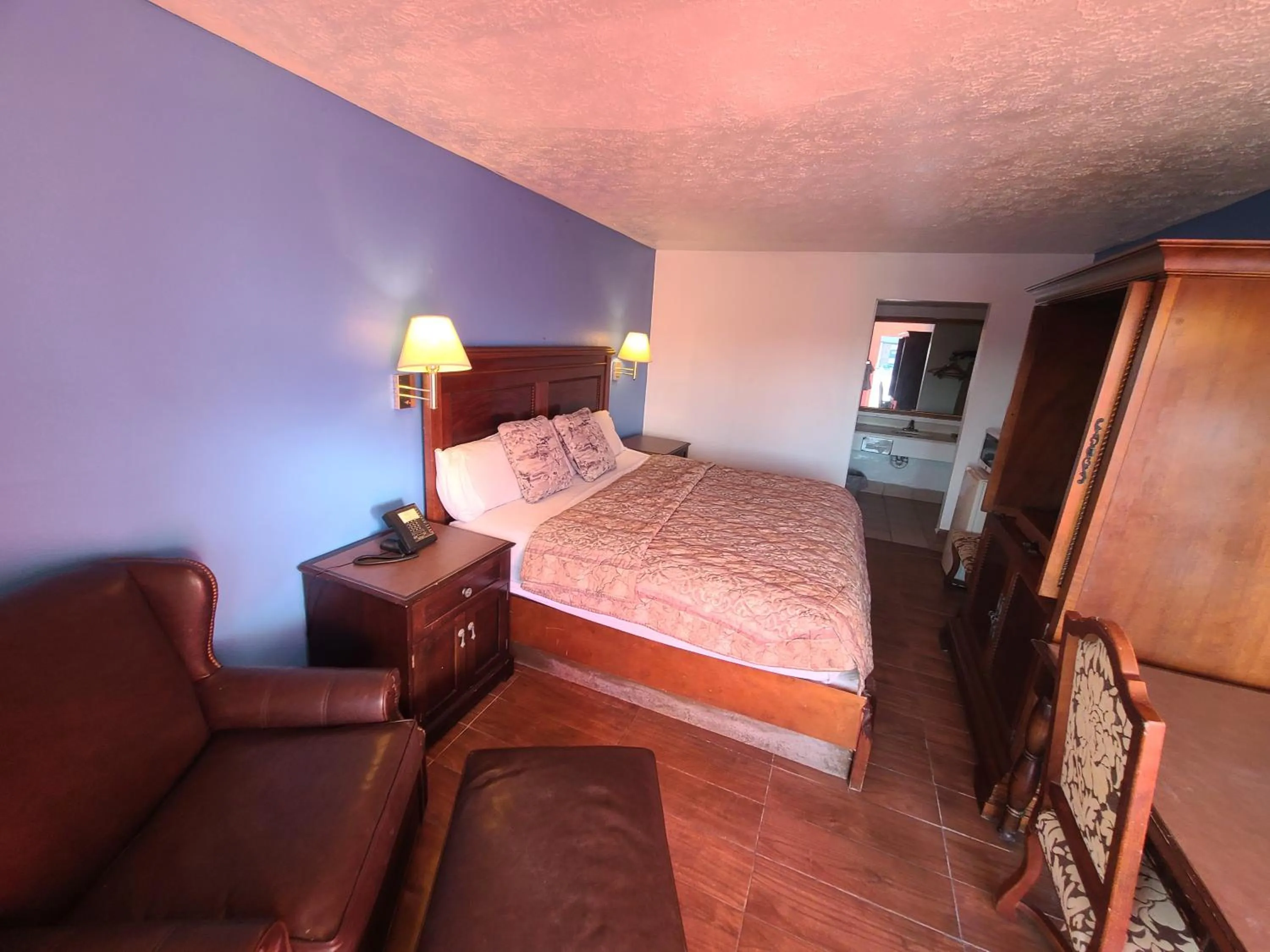 Bed in Garden Inn and Extended Stay