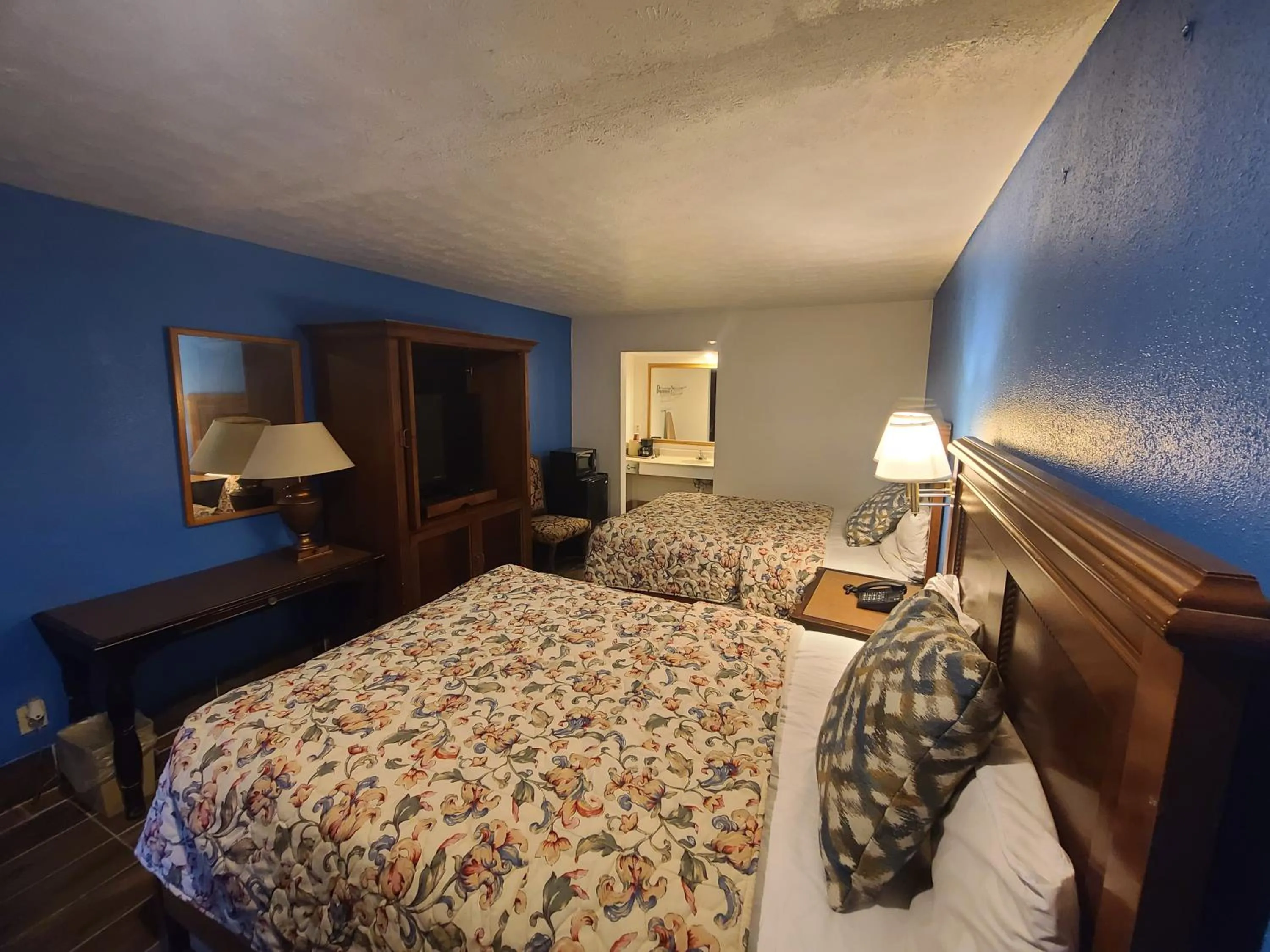 Bed in Garden Inn and Extended Stay