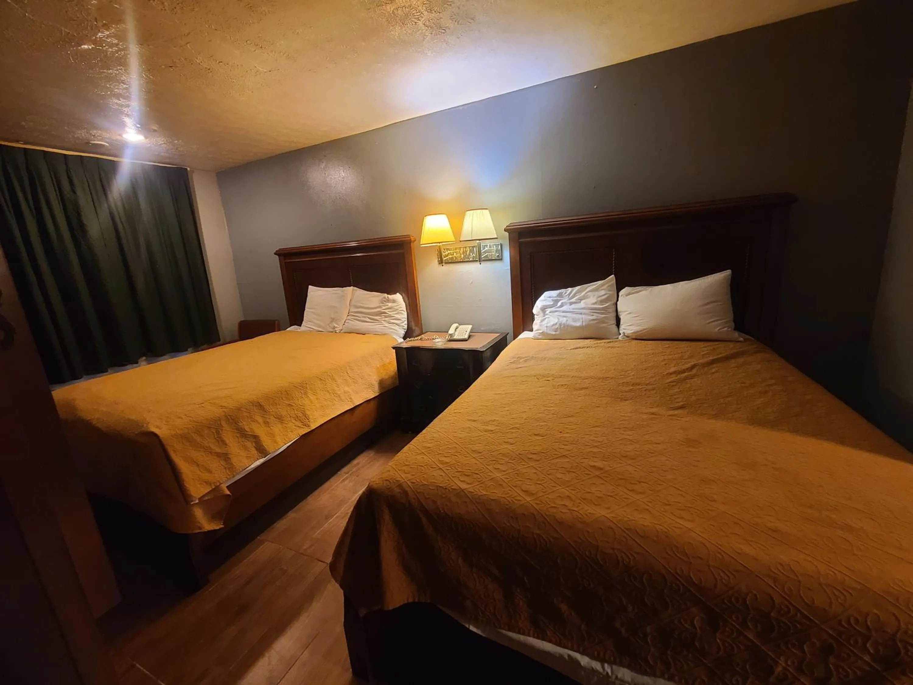 Bed in Garden Inn and Extended Stay