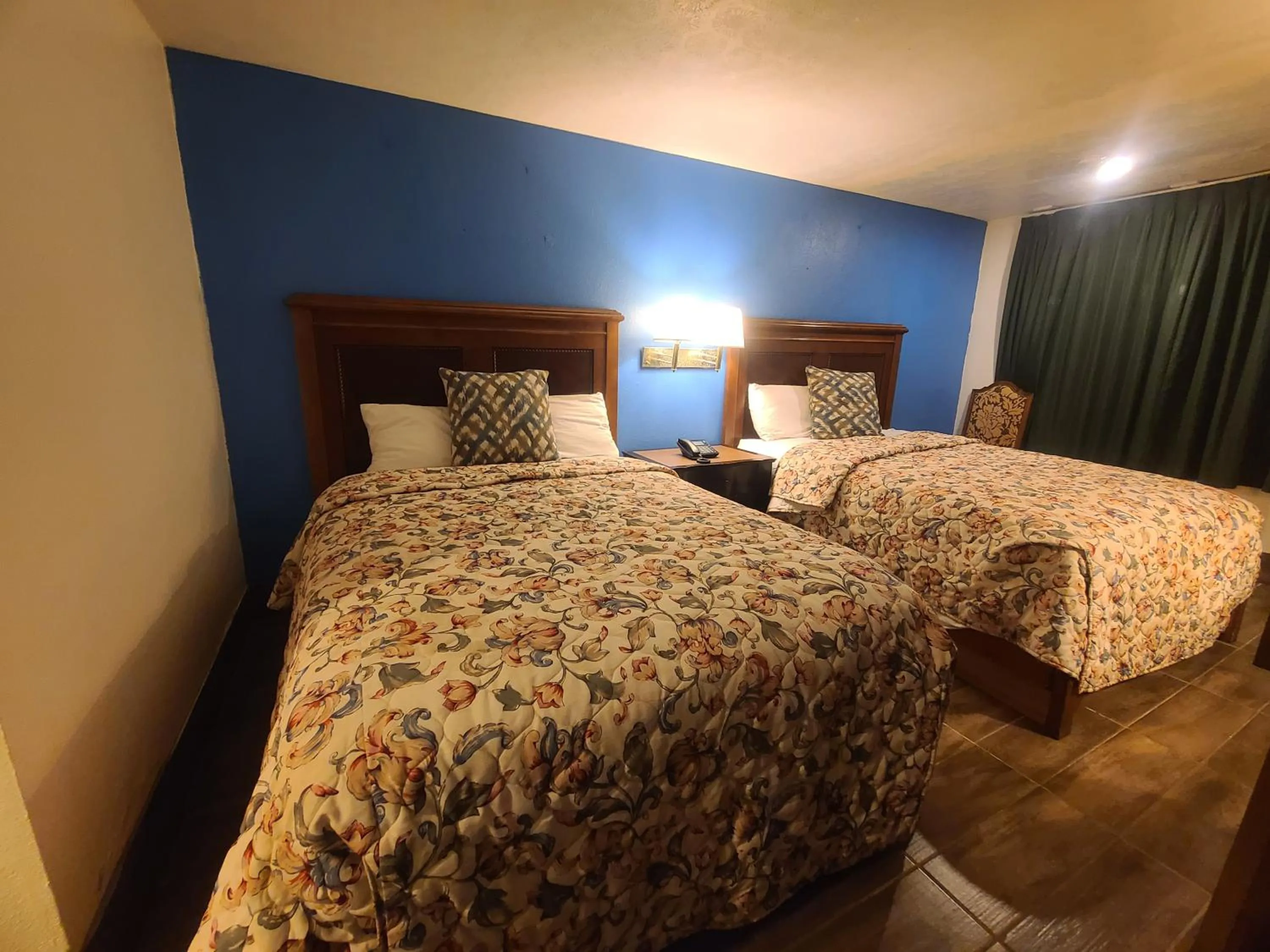 Bed in Garden Inn and Extended Stay