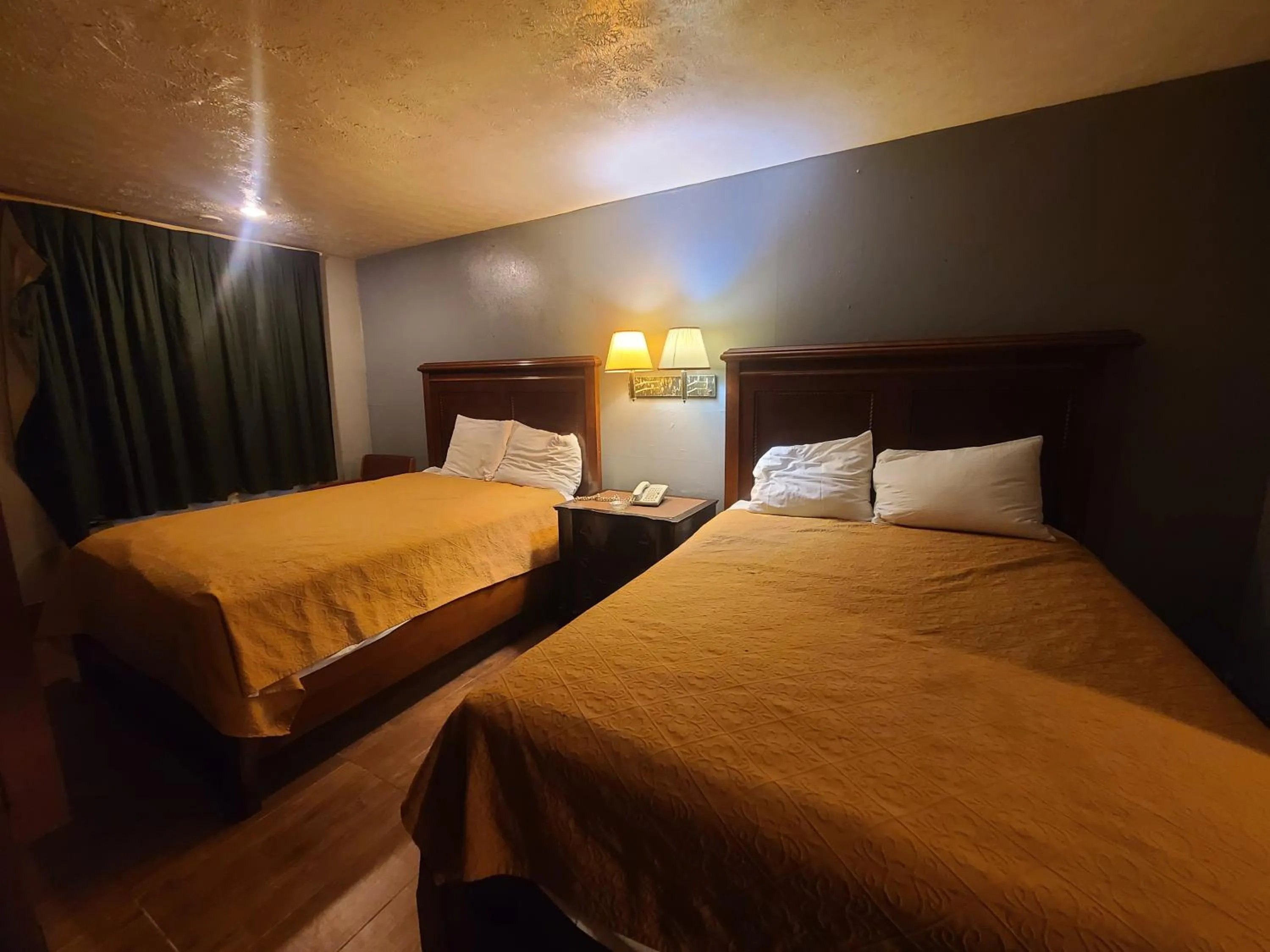 Bed in Garden Inn and Extended Stay