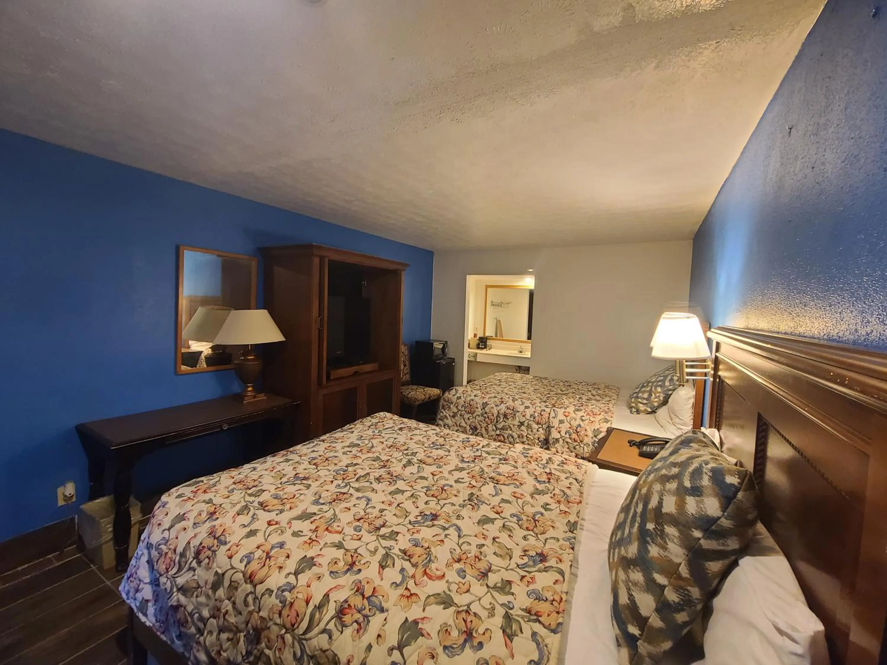 Bed in Garden Inn and Extended Stay