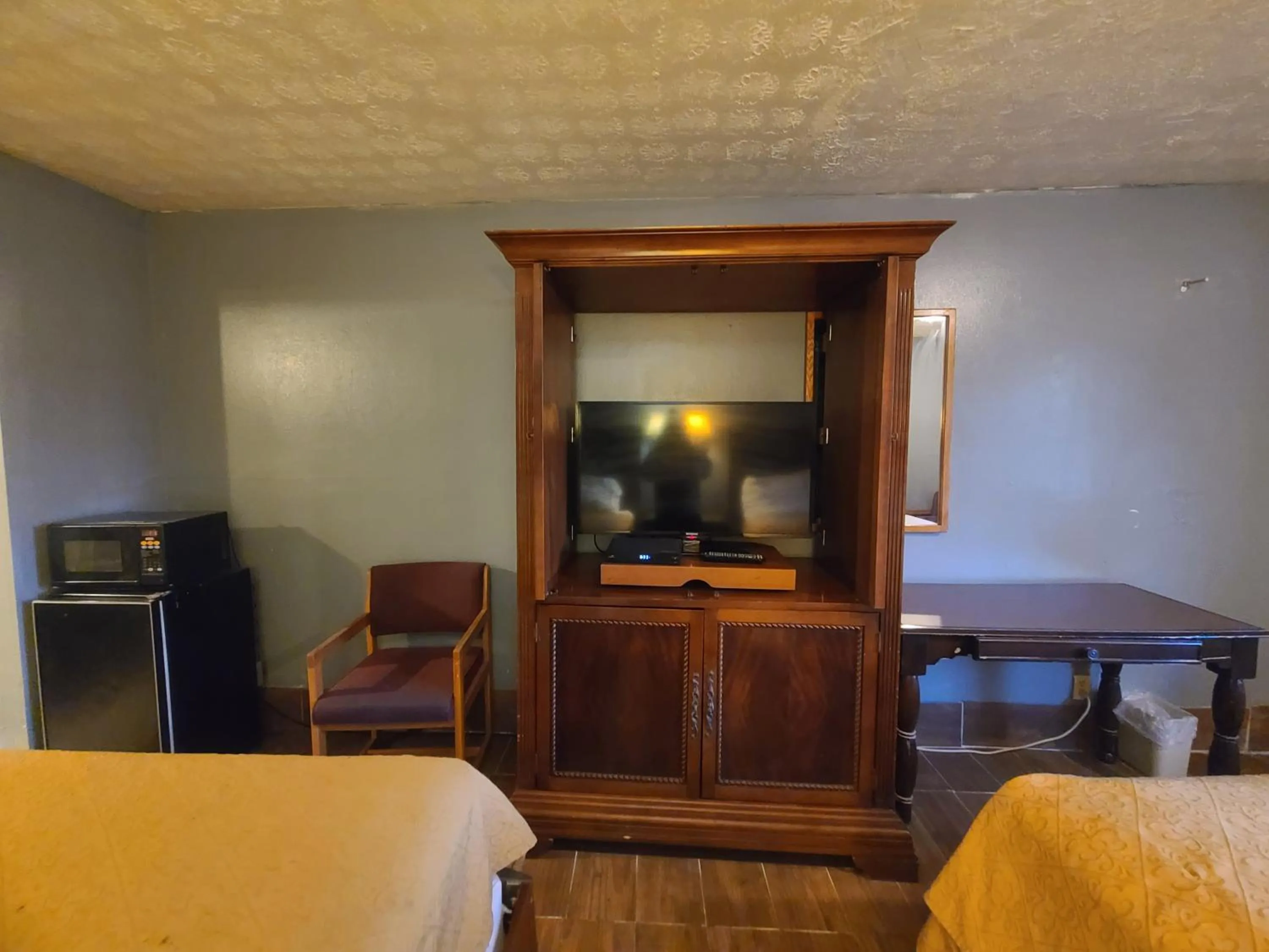 Bed in Garden Inn and Extended Stay