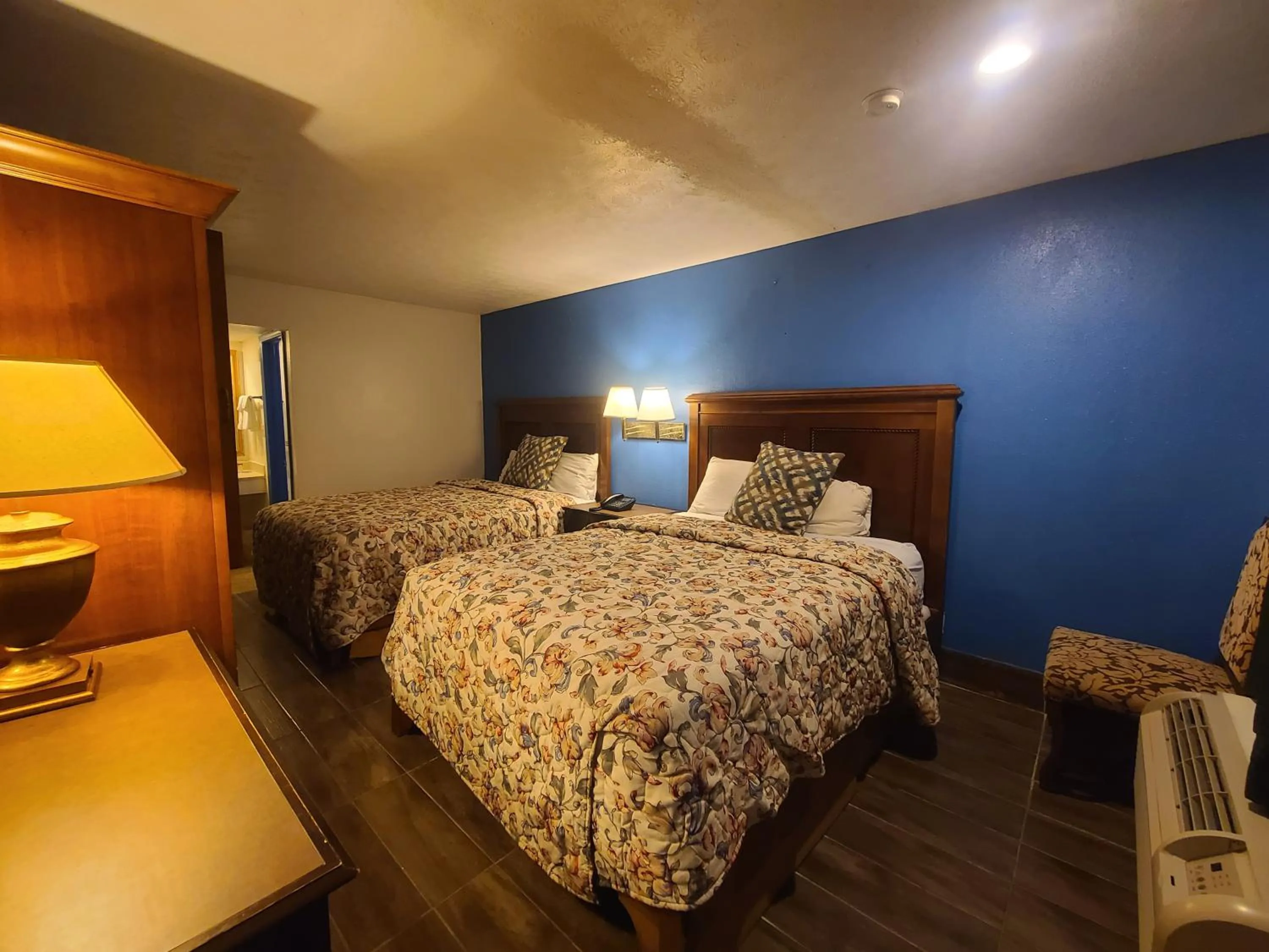 Bed in Garden Inn and Extended Stay