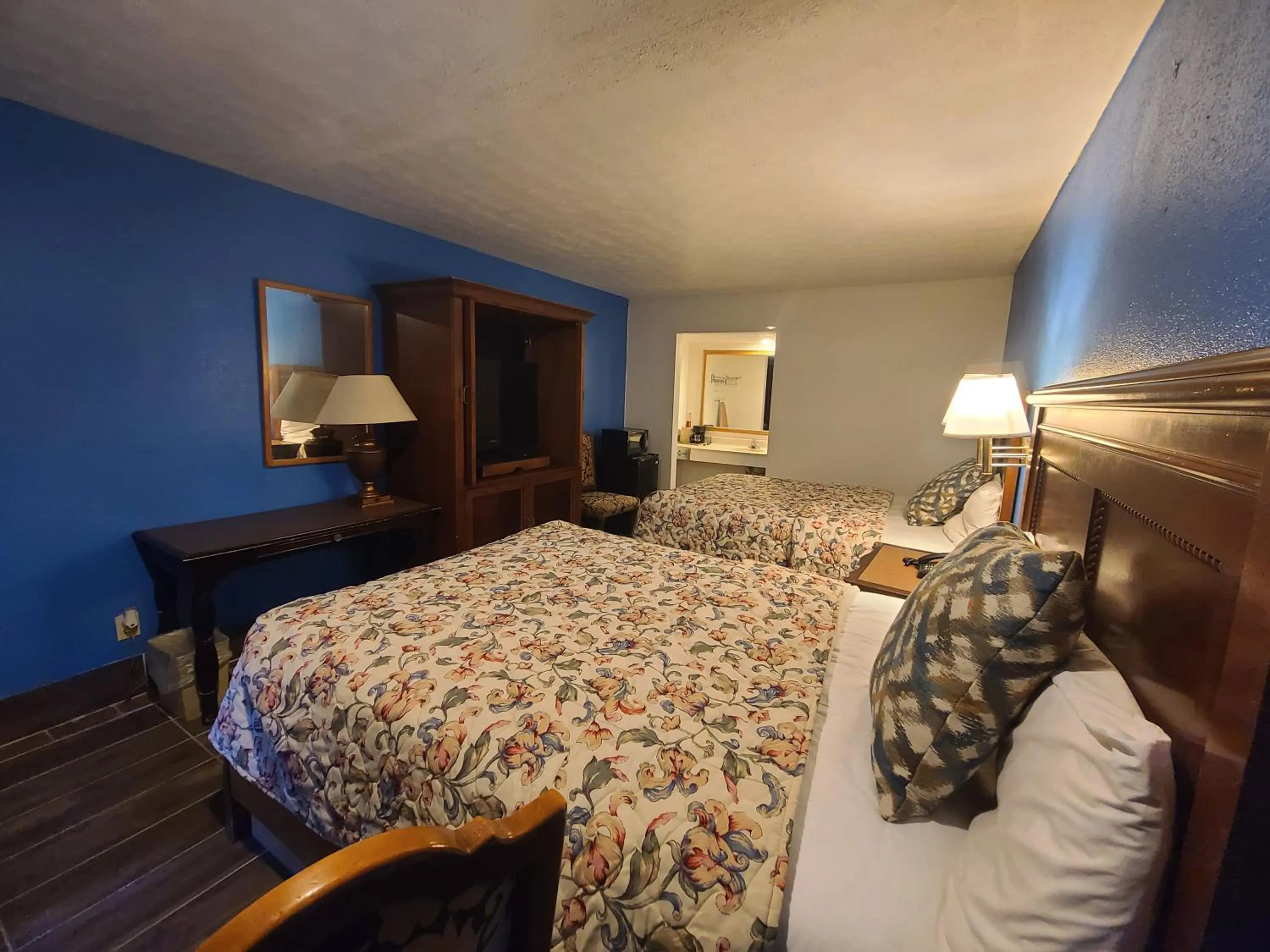Bed in Garden Inn and Extended Stay