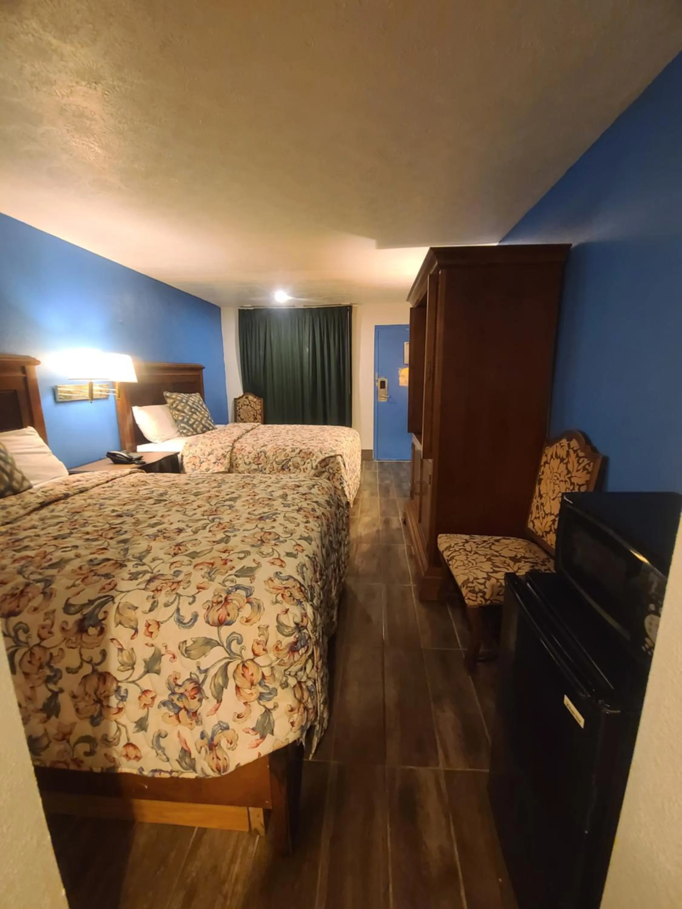 Bed in Garden Inn and Extended Stay