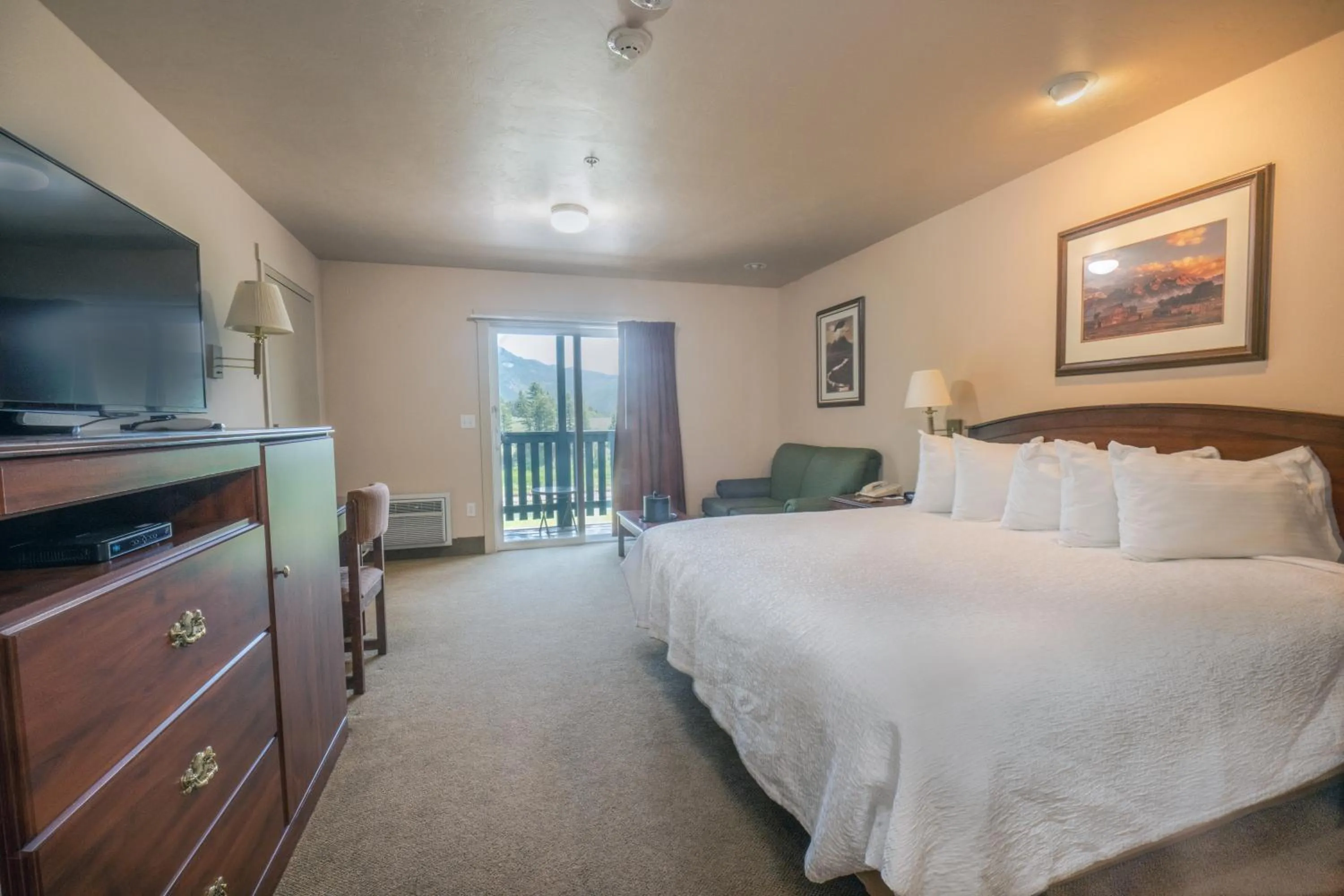 Bed in Flying Saddle Resort and Steak House