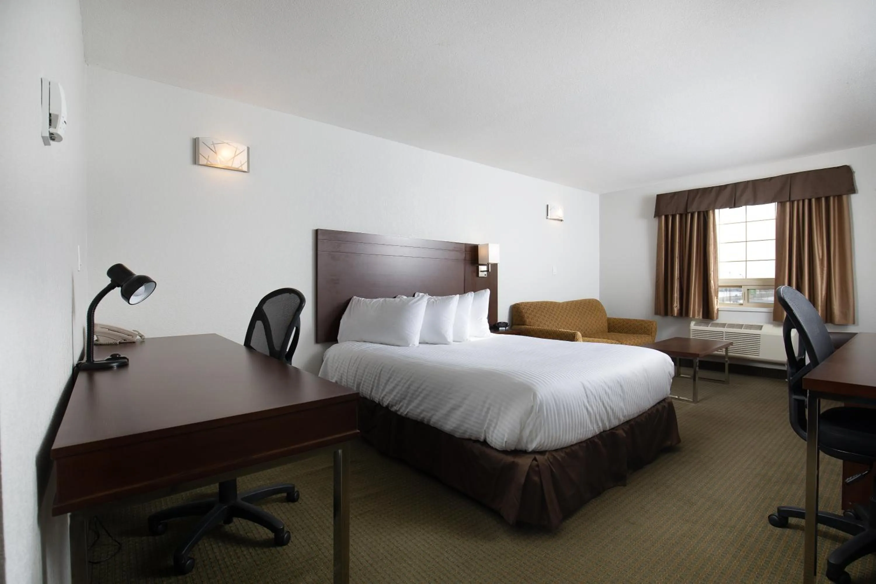 Bed in Service Plus Inns and Suites