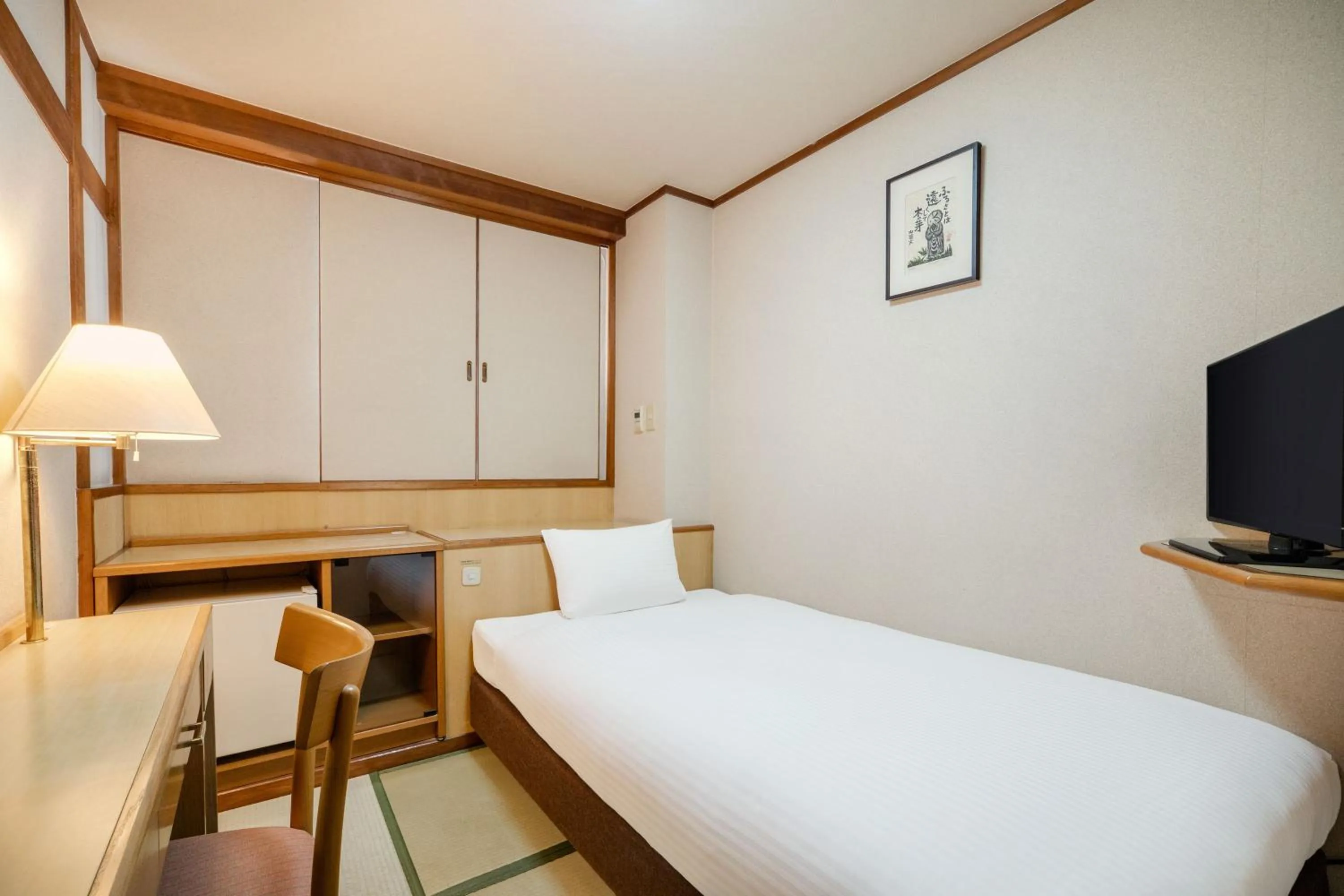 Bed in Central Hotel Sasebo