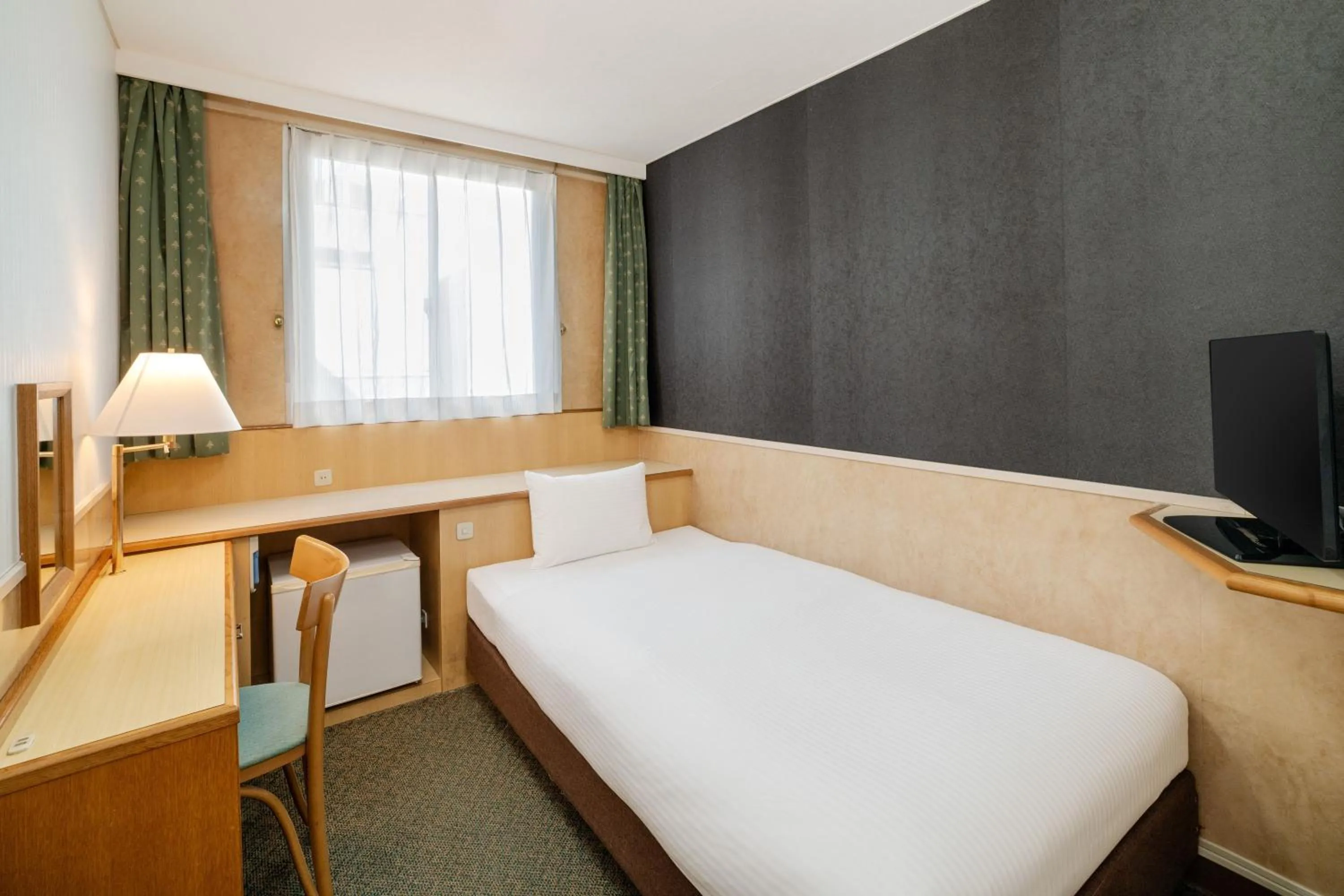 Bed in Central Hotel Sasebo