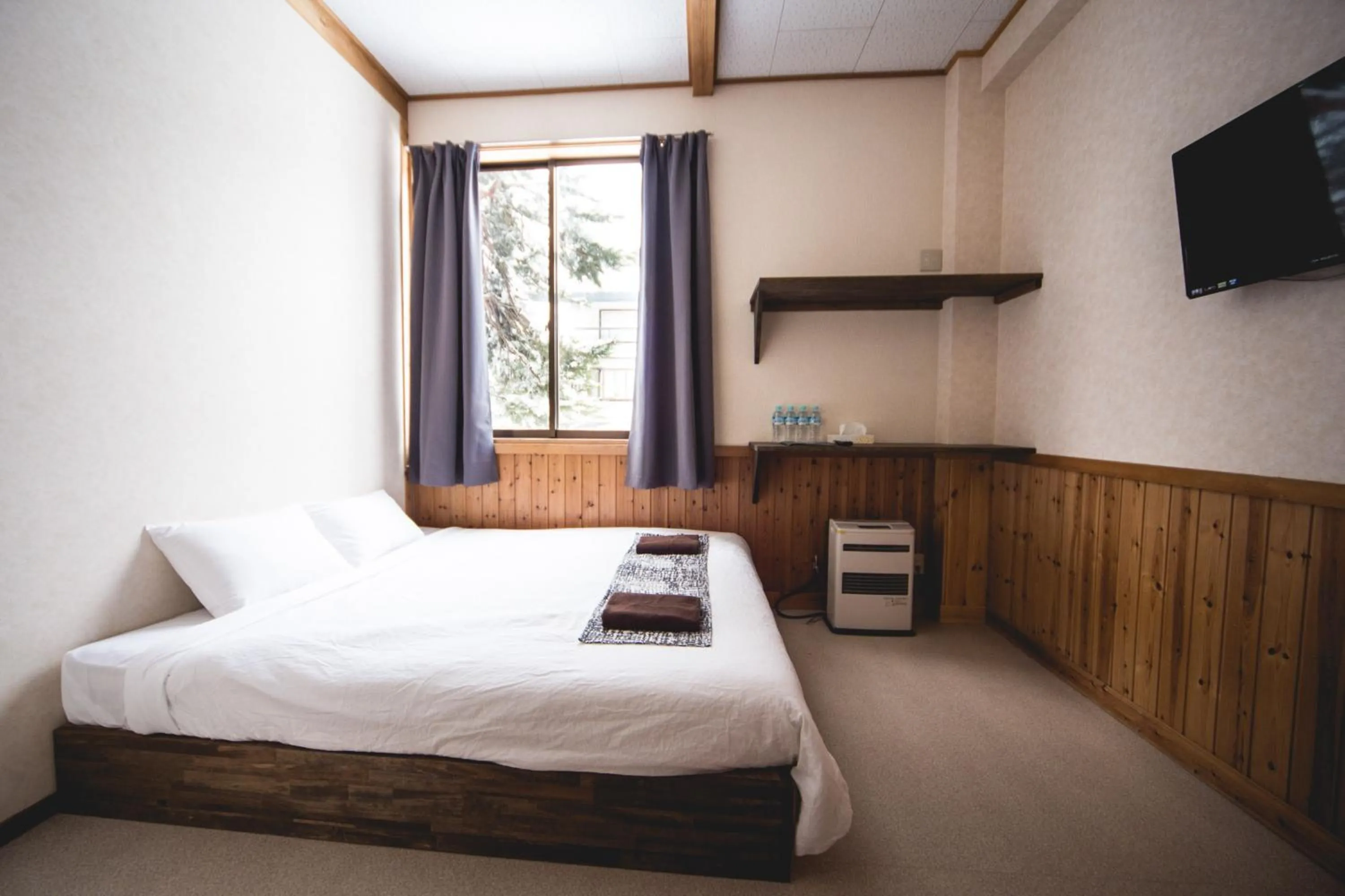 Bed in Hakuba Cortina Lodge