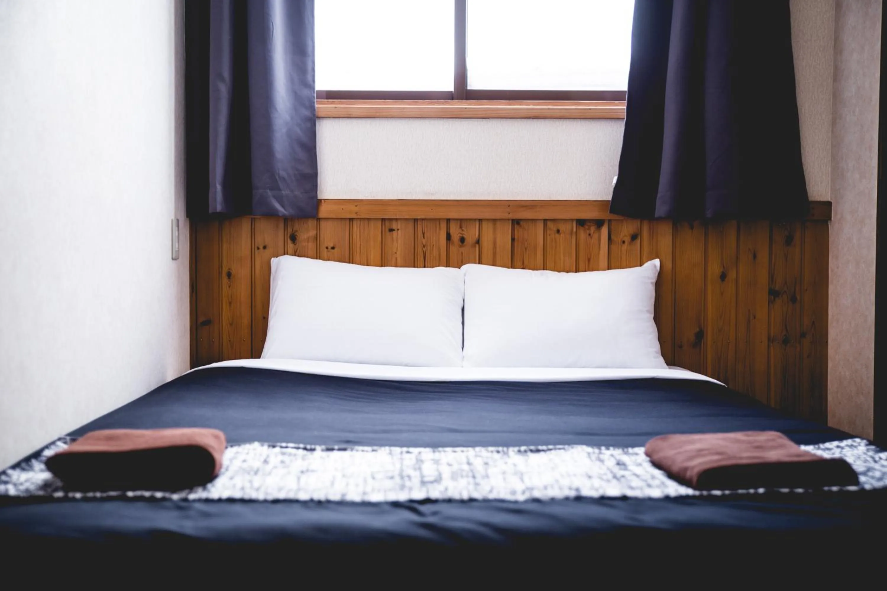 Bed in Hakuba Cortina Lodge