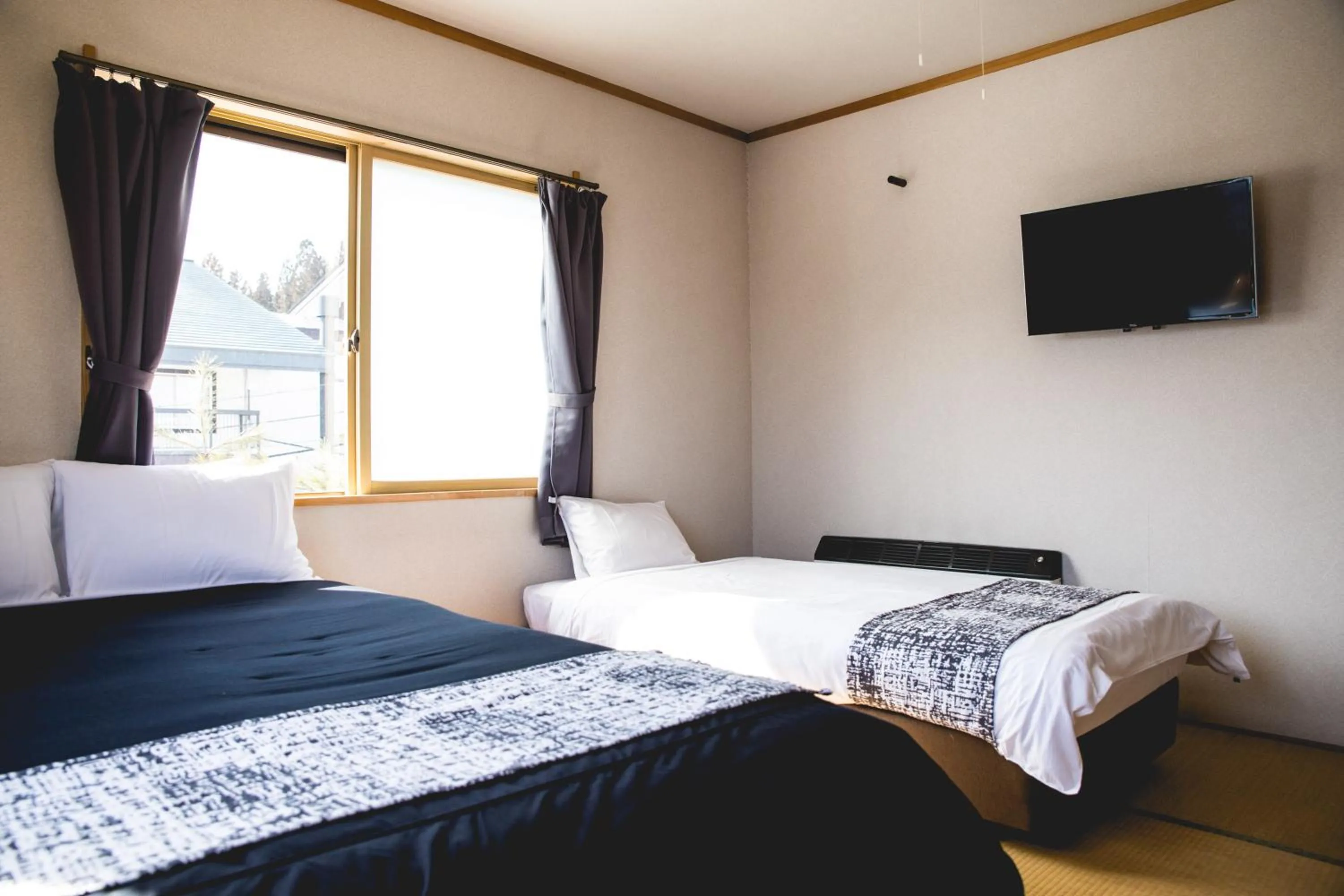 Bed in Hakuba Cortina Lodge