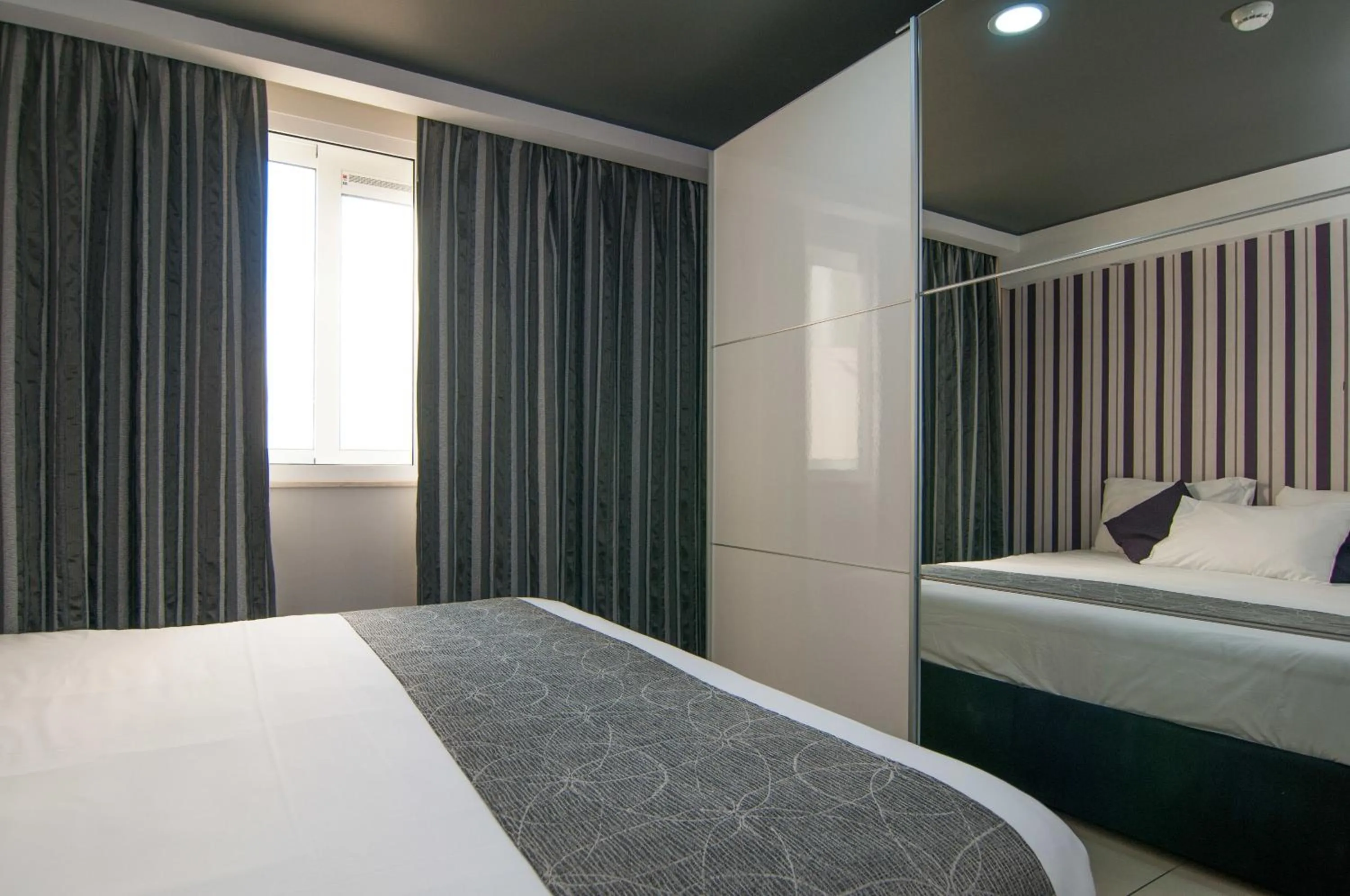 Bedroom in Pebbles Boutique Aparthotel