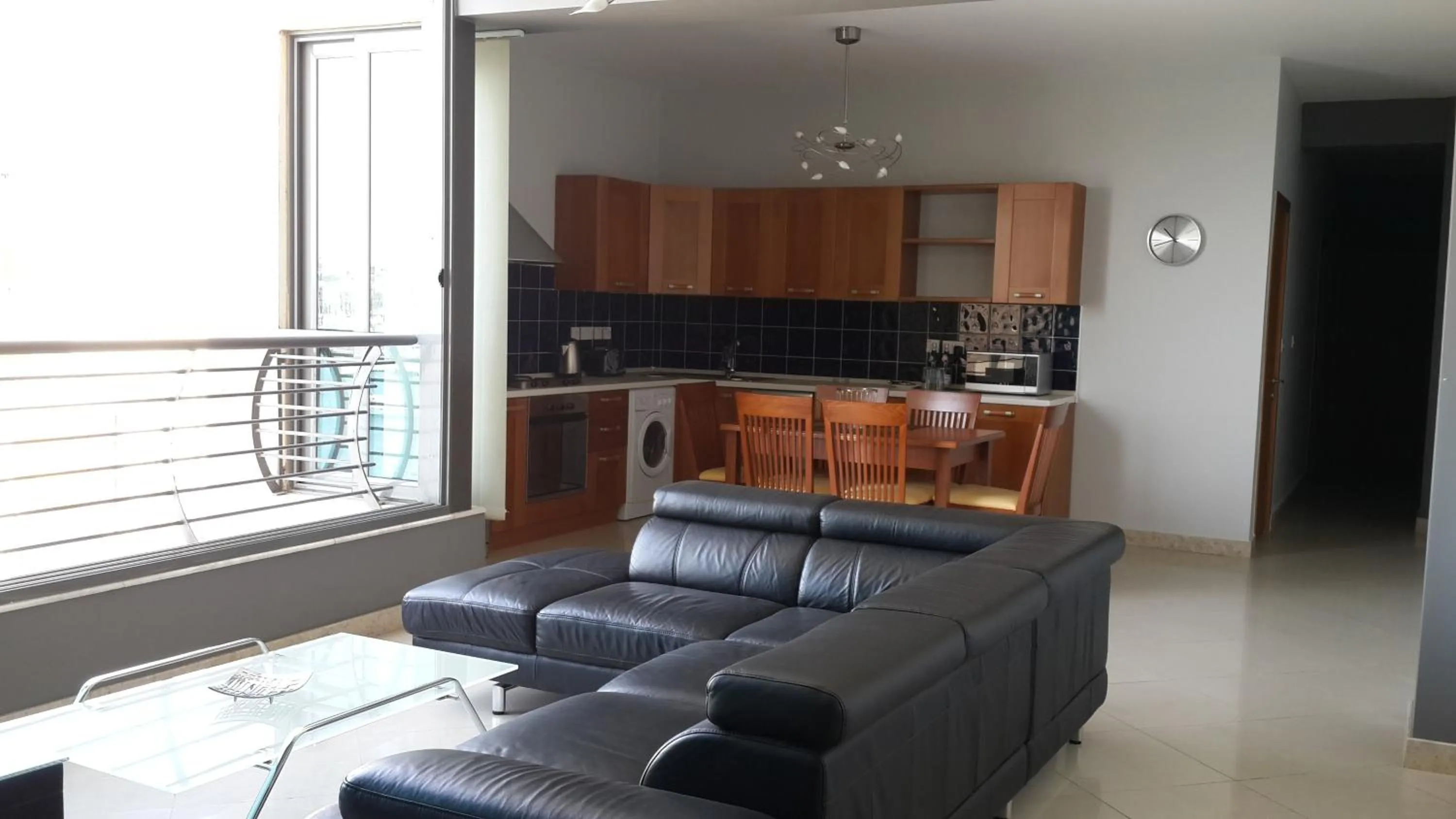 Living room, Kitchen/Kitchenette in Pebbles Boutique Aparthotel