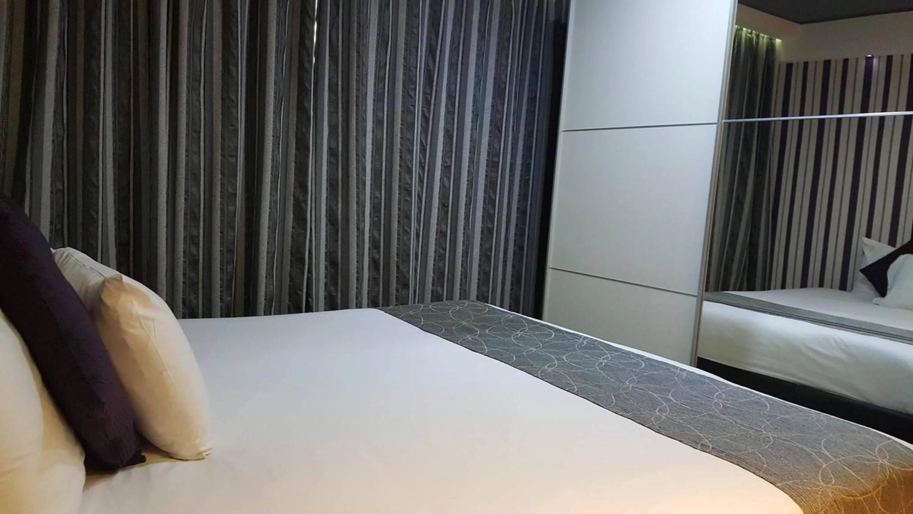 Bed in Pebbles Boutique Aparthotel