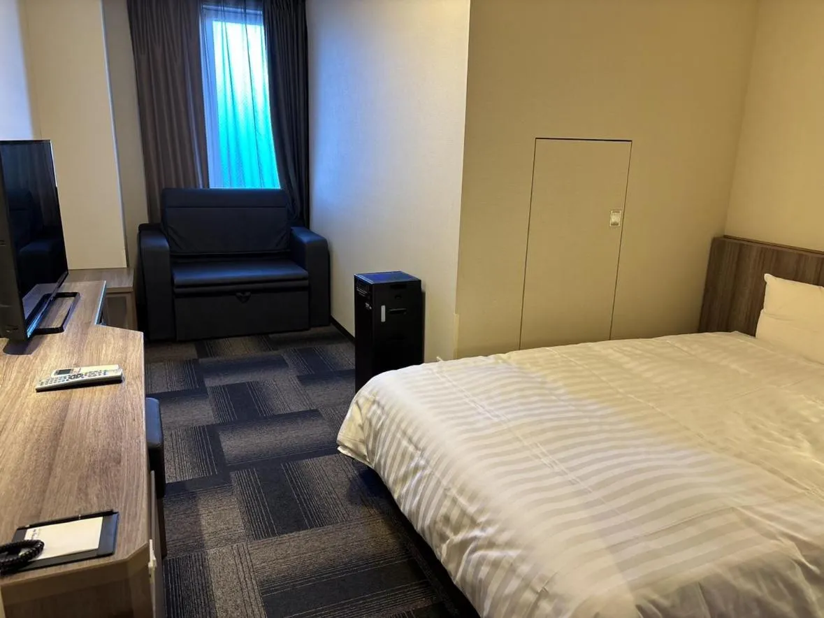 Bed in Dormy Inn Korakuen