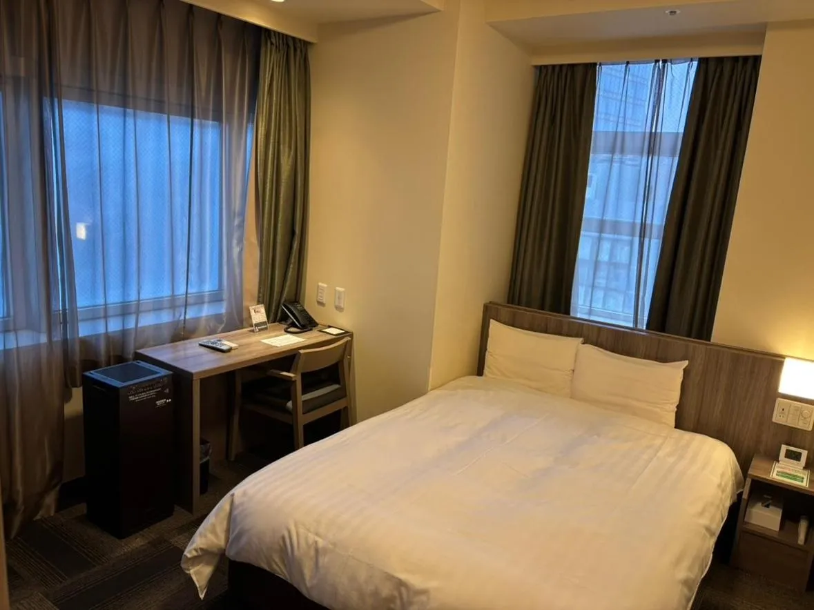 Bed in Dormy Inn Korakuen