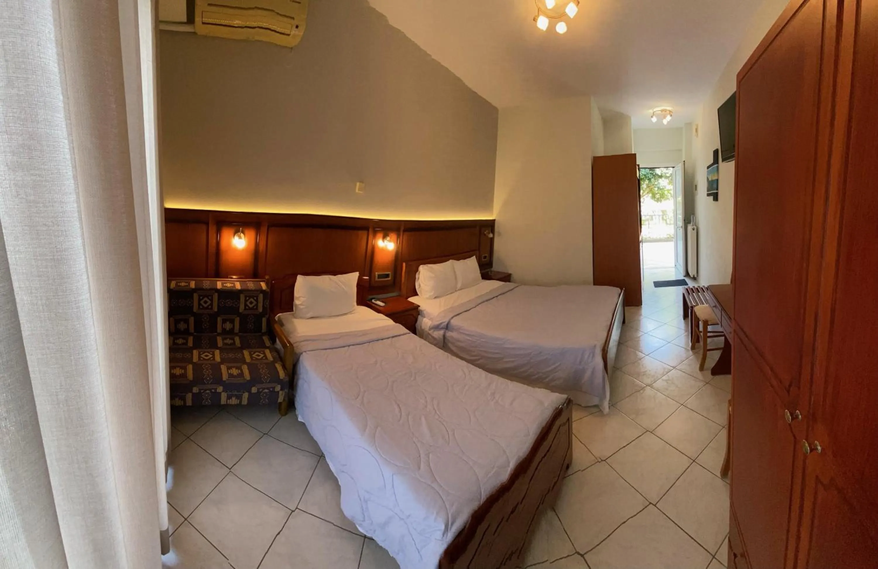 Bed in Paradosi Rooms