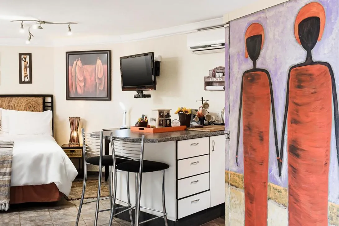 Bed in Glenda's Guest Suites