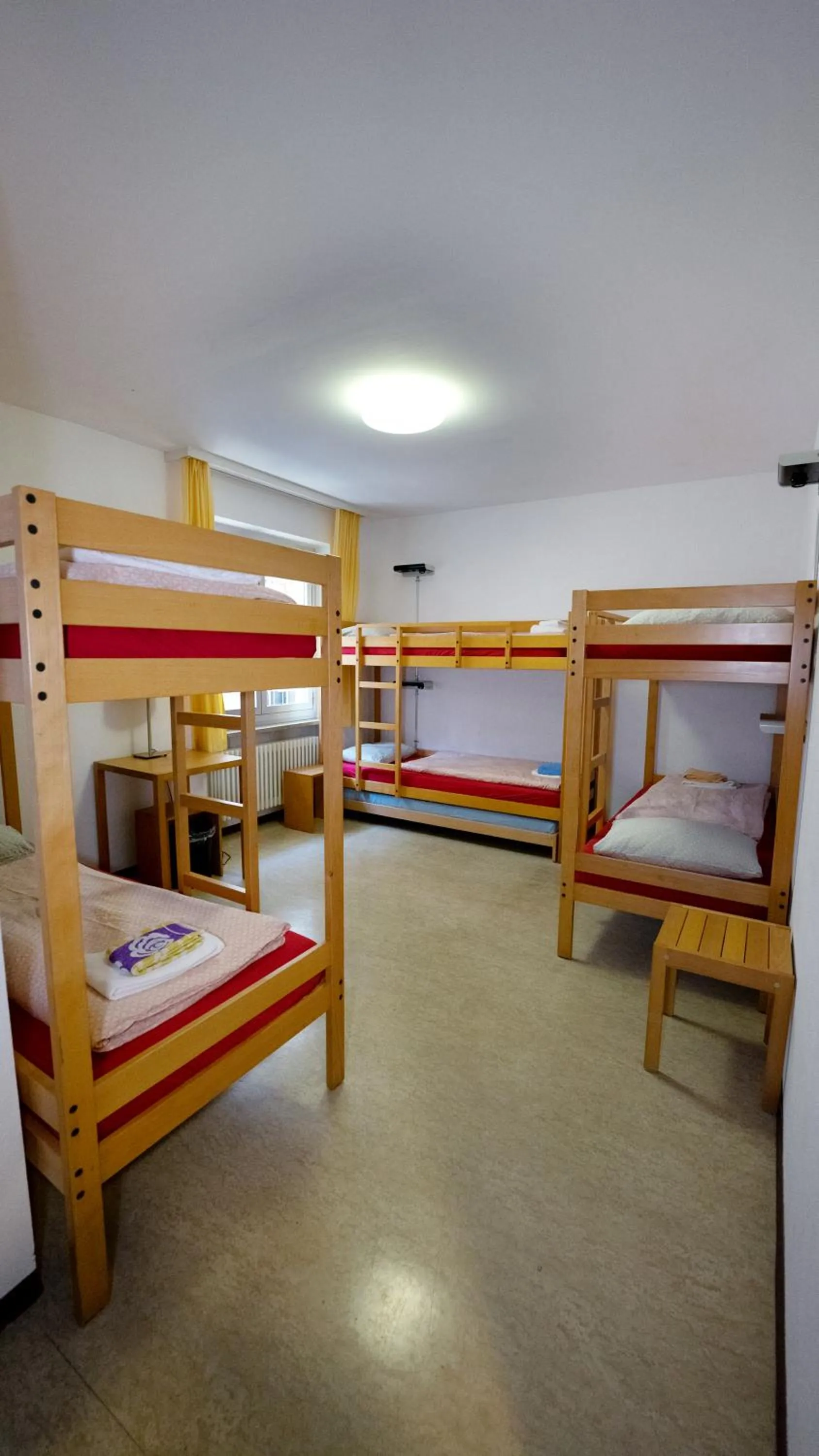 Bed in 6-Bed Dormitory Room with Shower in Locarno Youth Hostel