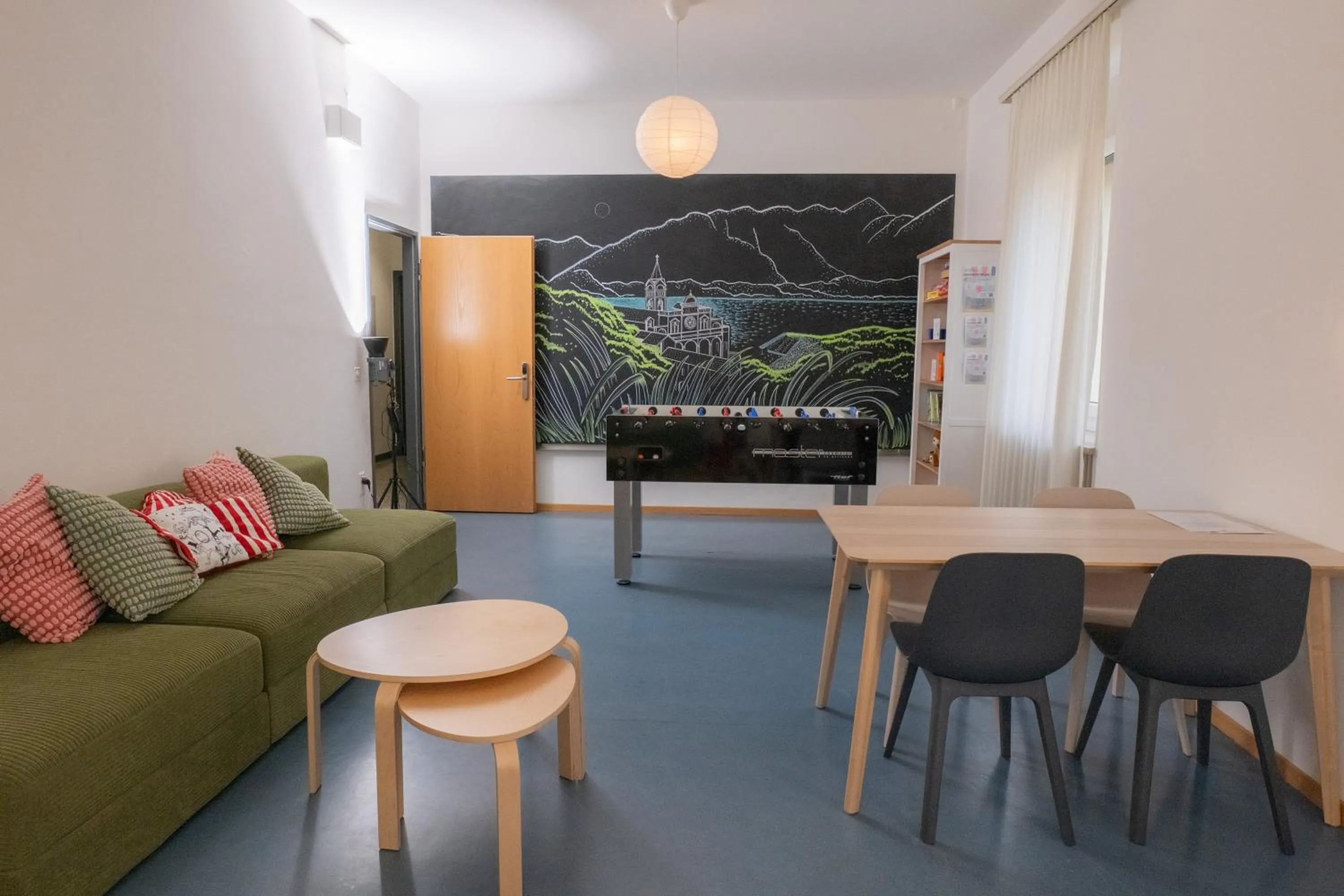 Communal lounge/ TV room in Locarno Youth Hostel