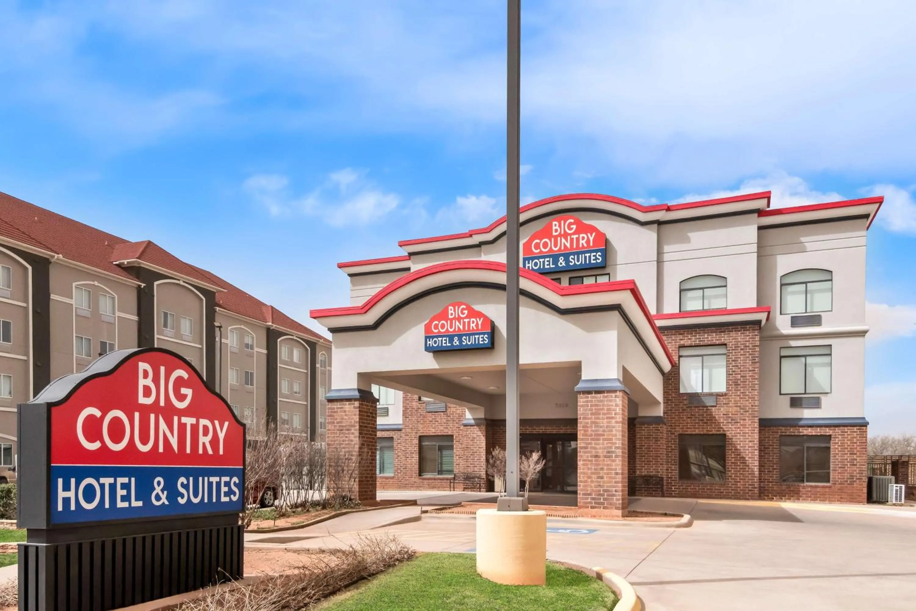 Property building in Big Country Hotel & Suites, SureStay Collection by BW